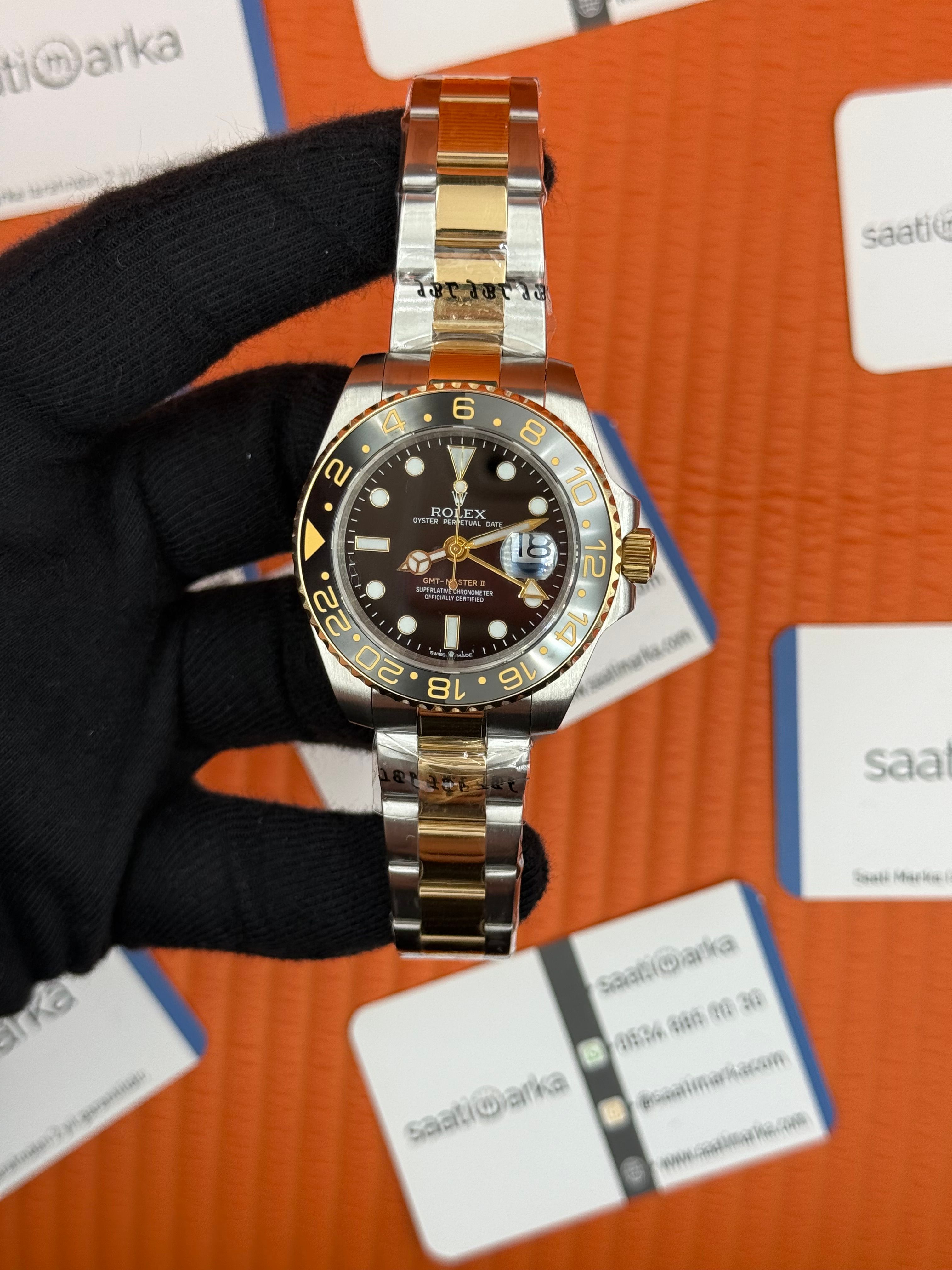 ROLEX Gmt Master black dila bezel gold silver kordon 40mm