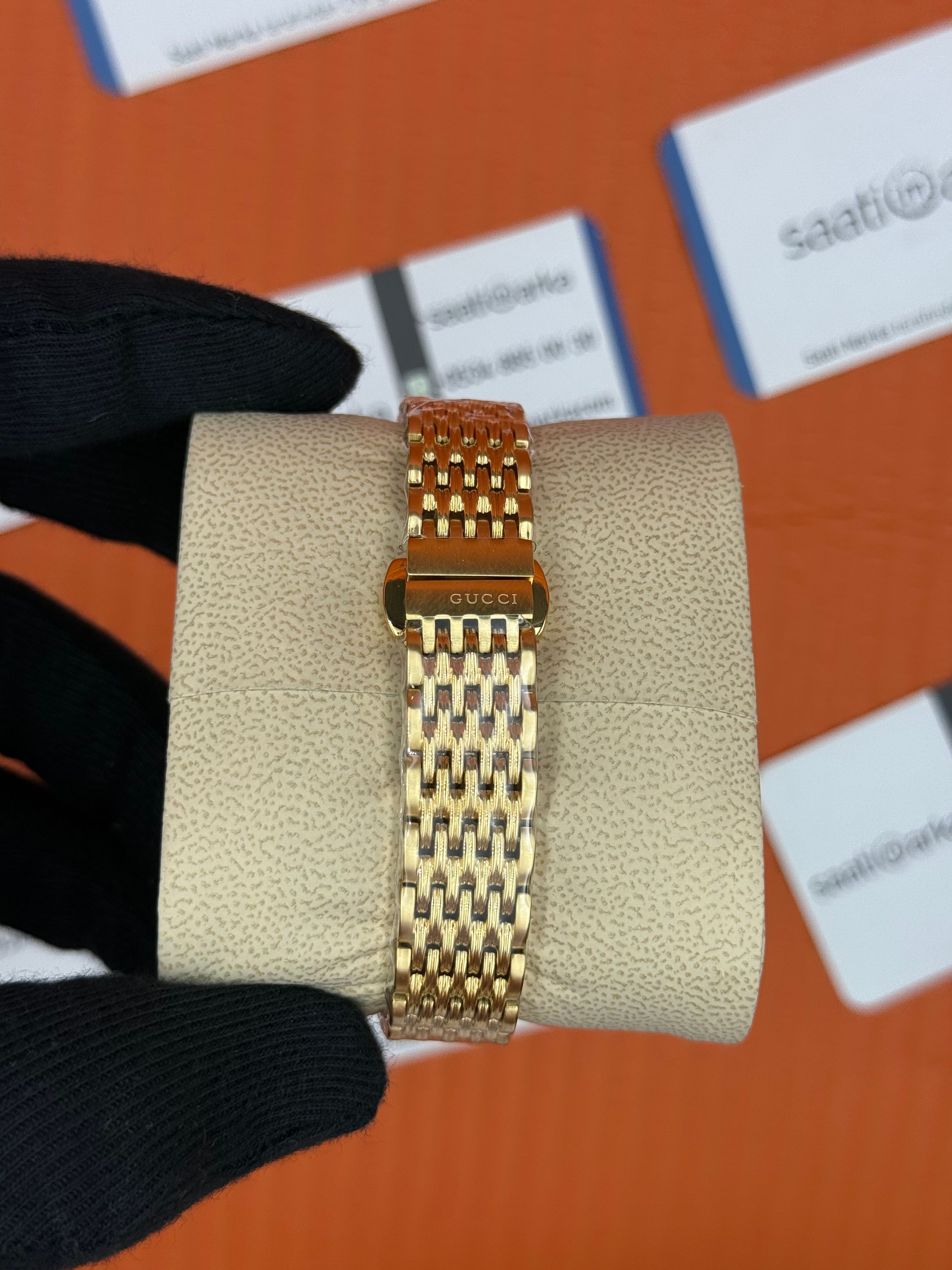 GUCCI şampanya kadran gold kasa kordon kadın kol saati