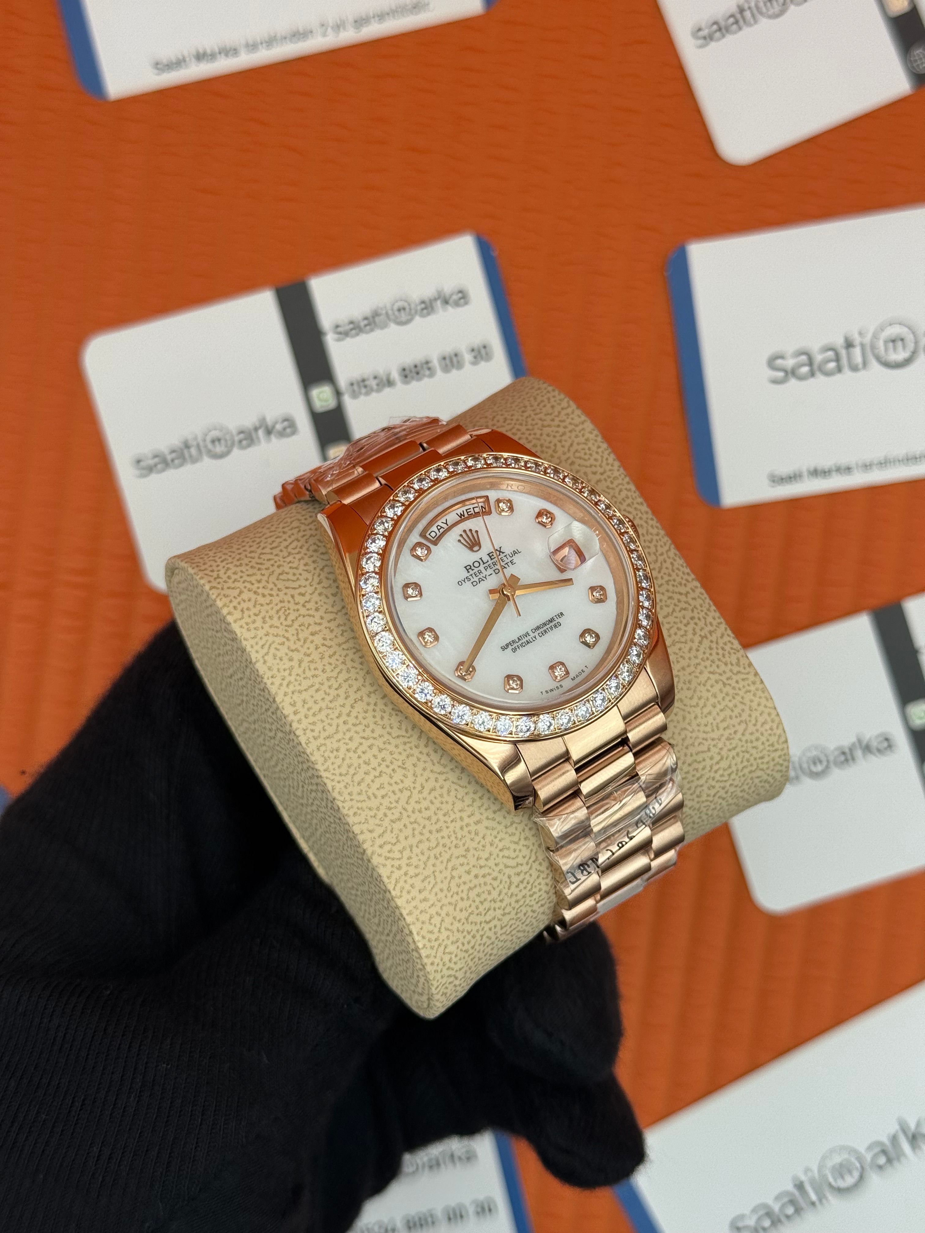 ROLEX Day Date baget taşlı beyaz kadran rose kasa-kordon oyster