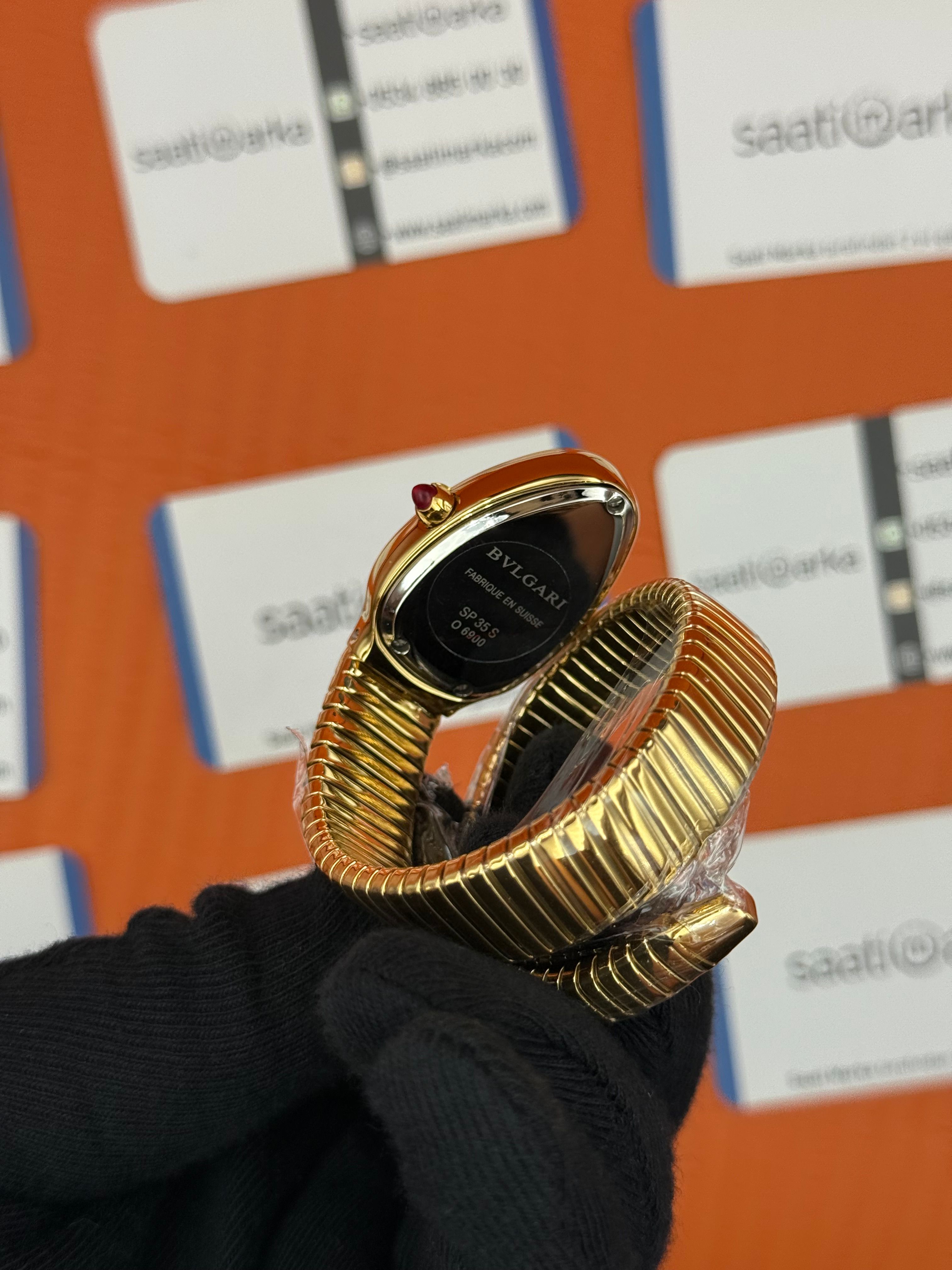 BVLGARİ serpenti tek sarma gold kordon taşlı bezel şampanya kadran kadın kol saati
