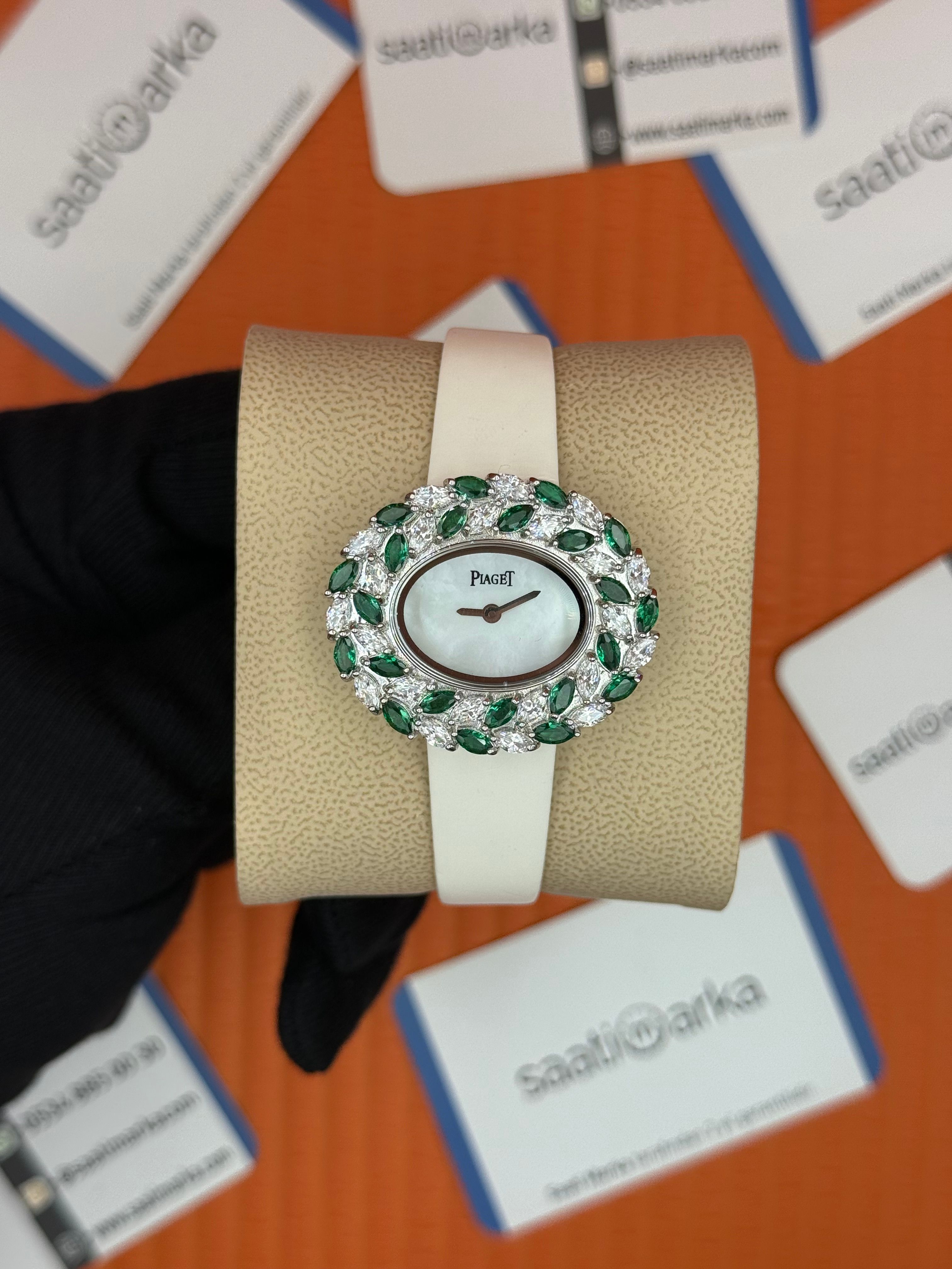 PIAGET taşlı bezel sedef kadran beyaz deri kordon
