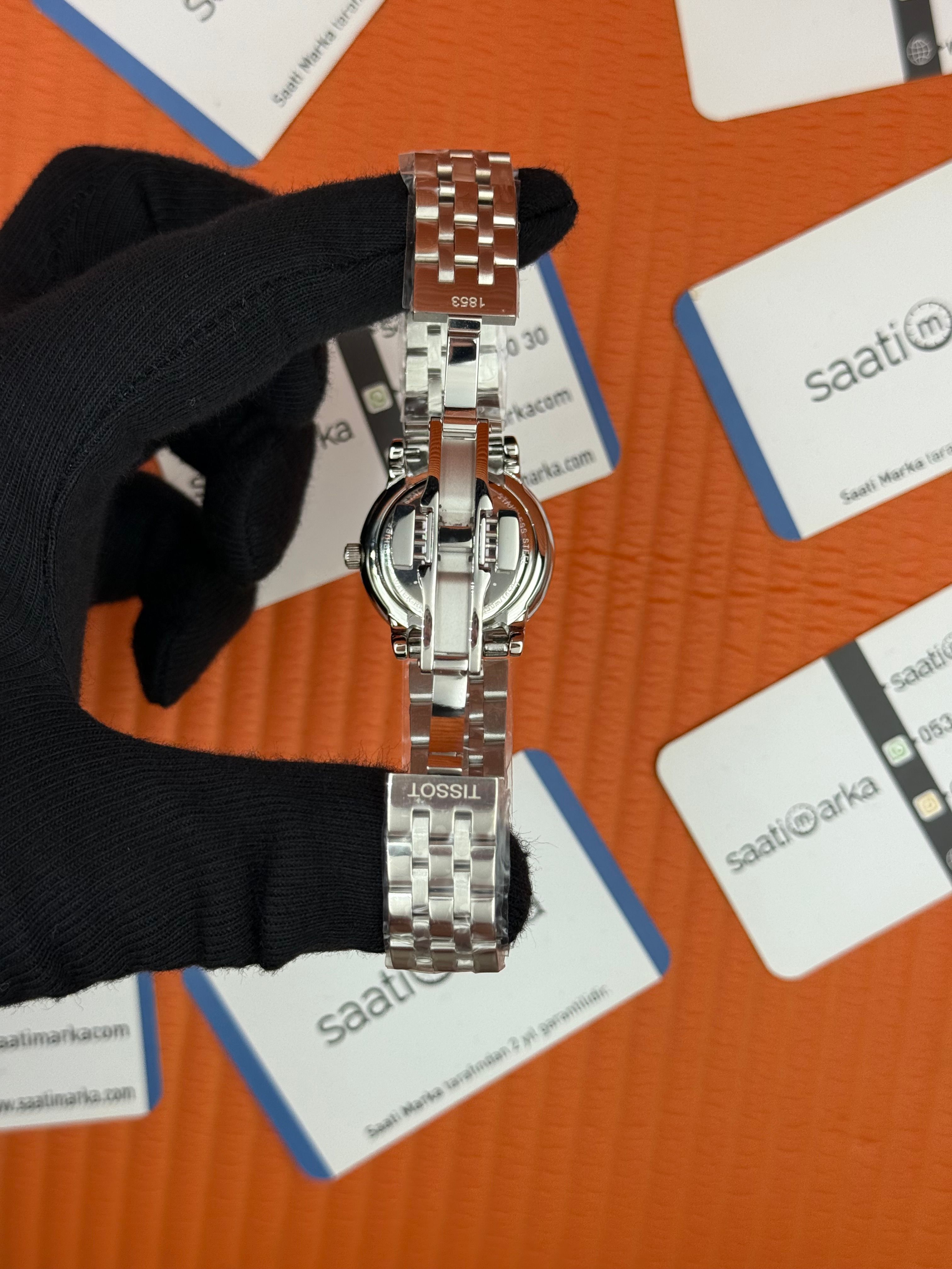 TISSOT beyaz baget taşllı kadran silver kasa kordon kadın kol saati
