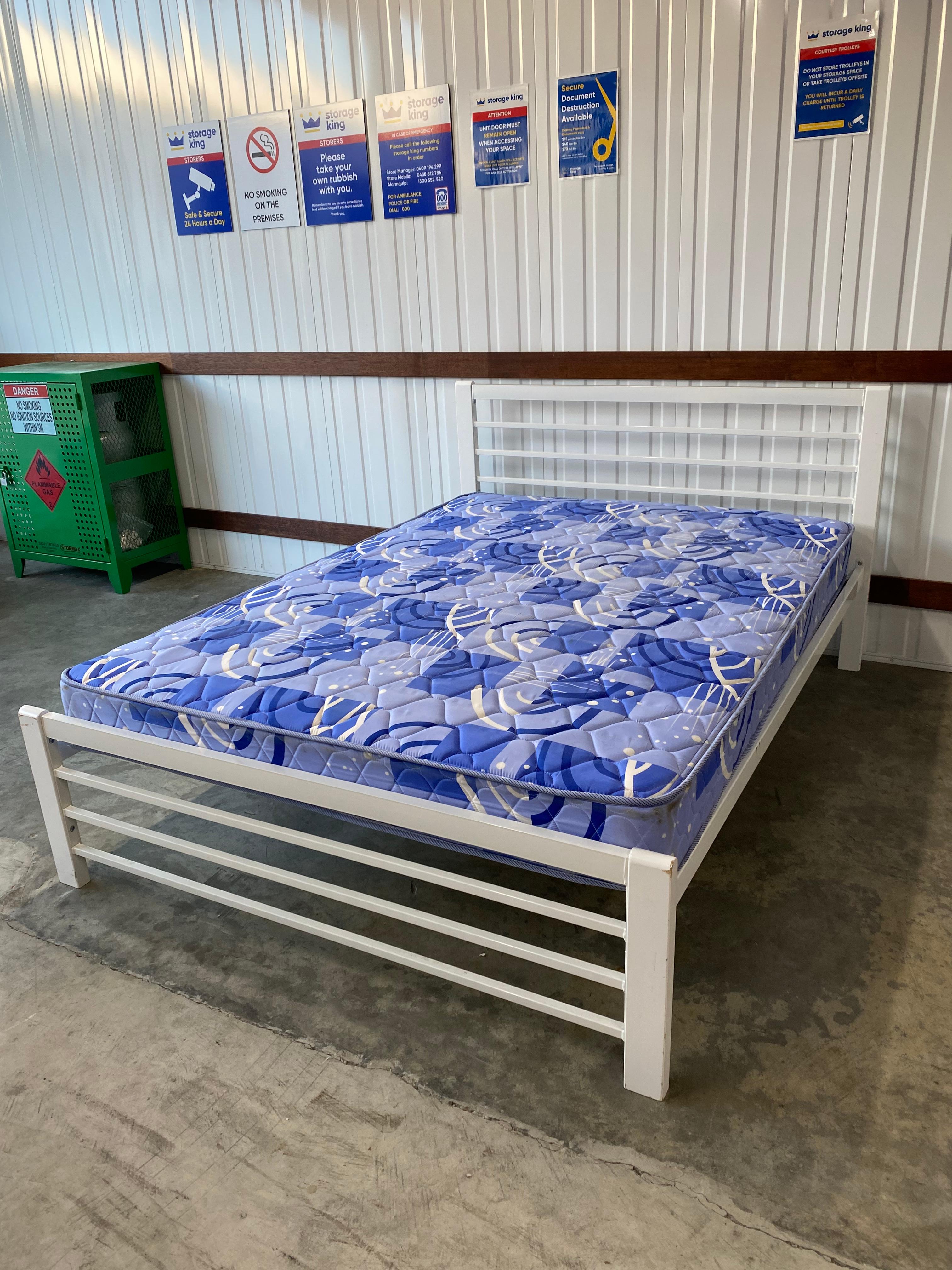 WHITE IRON BED AND BLUE MATTRESS