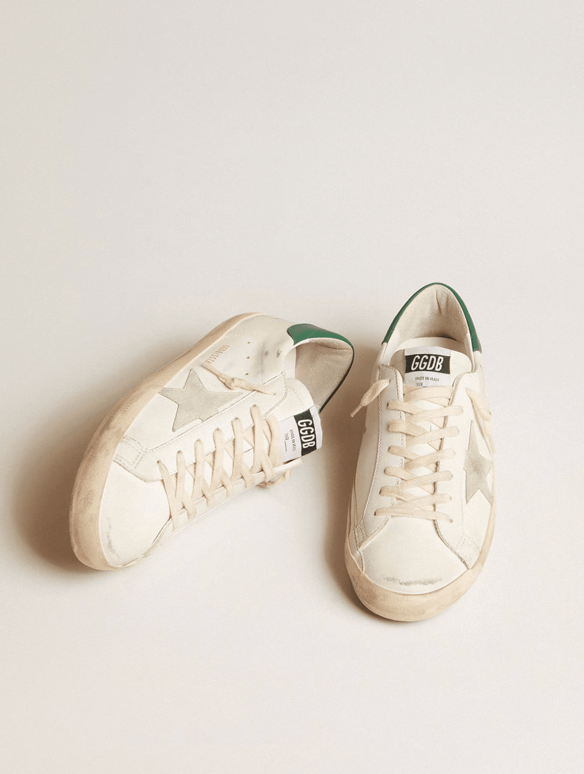 Golden goose Super-Star in white leather with ice-gray suede star and green leather heel tab Erkek