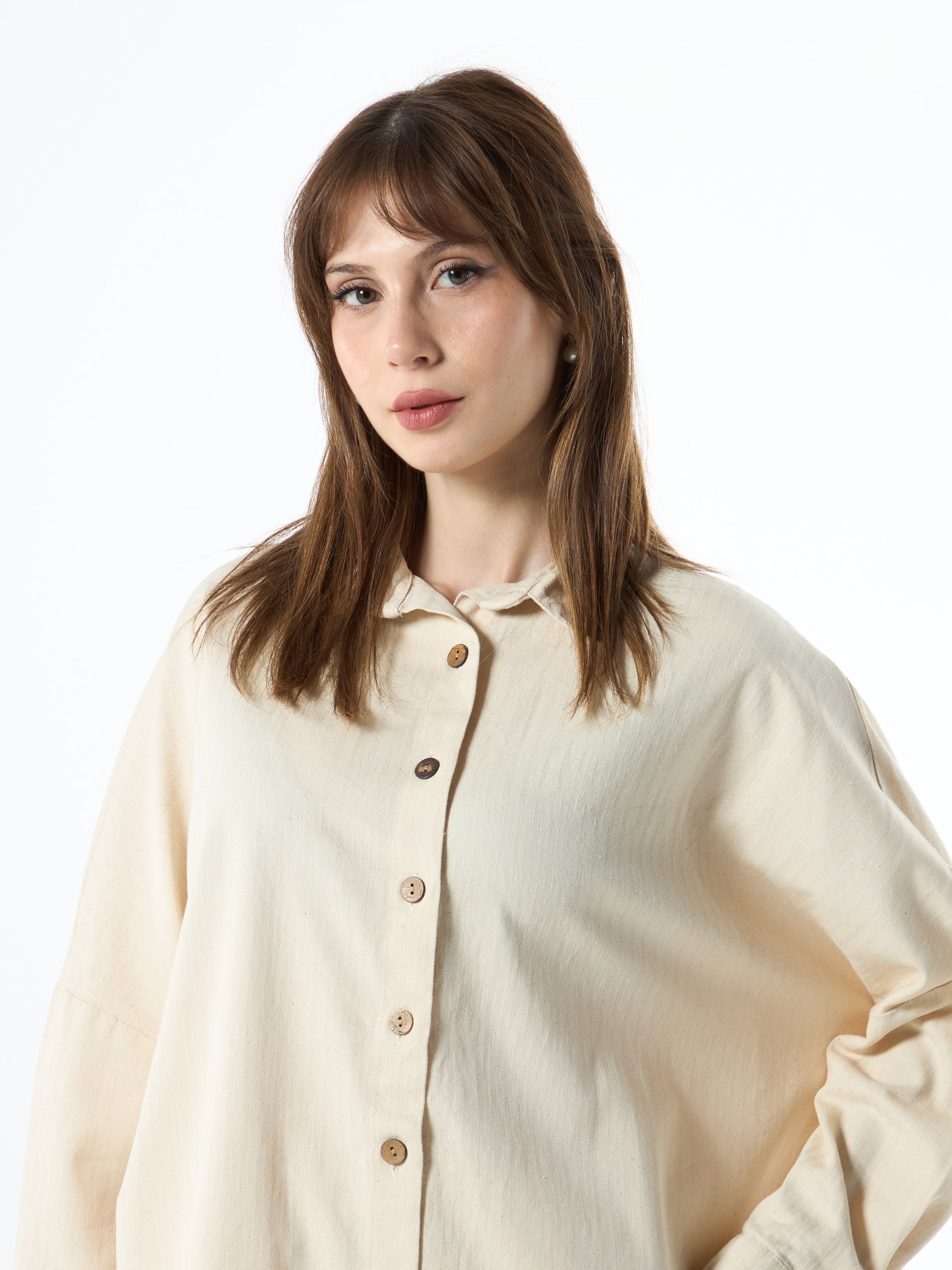 beige shirt with wooden buttons