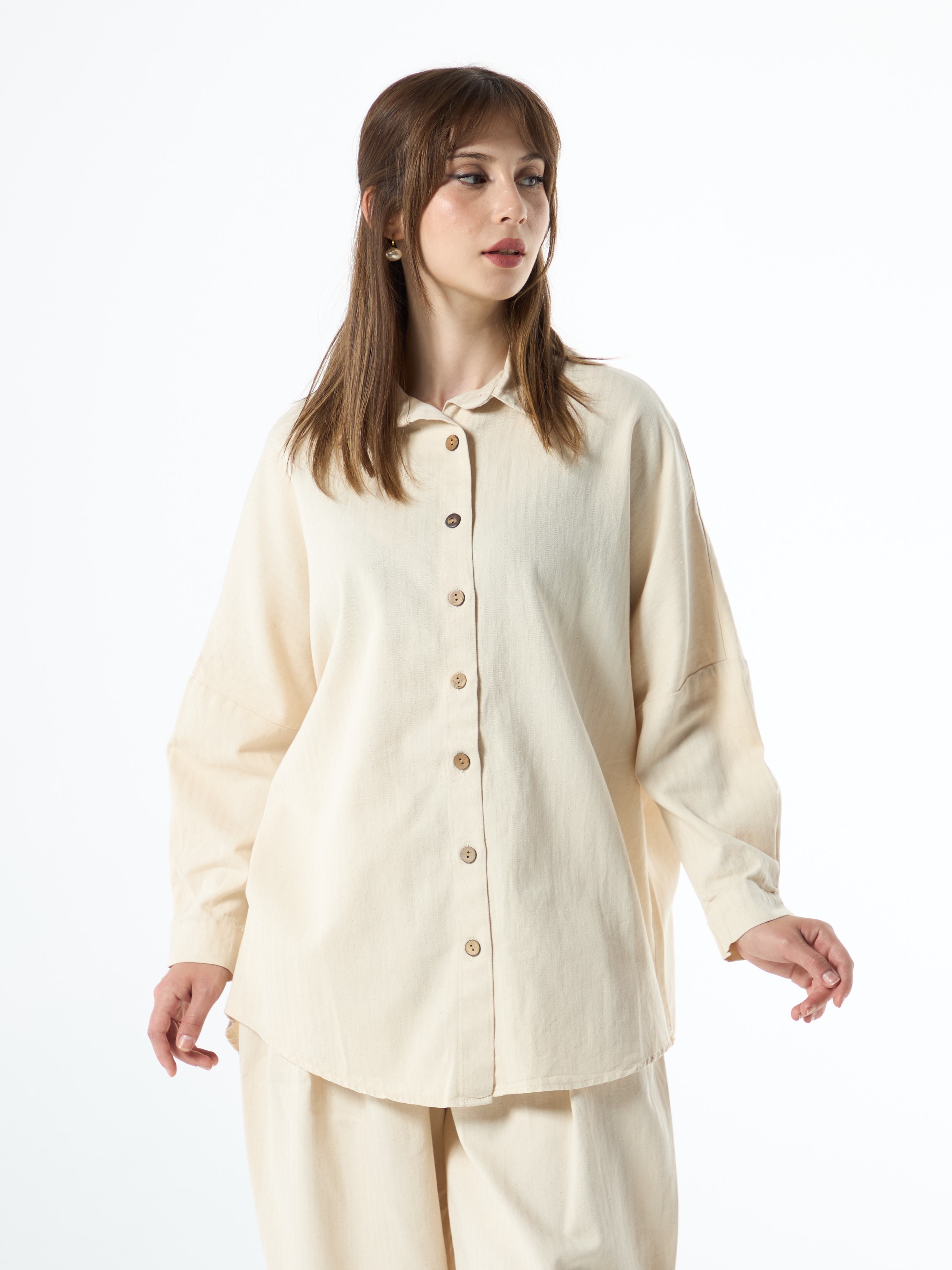 beige shirt with wooden buttons