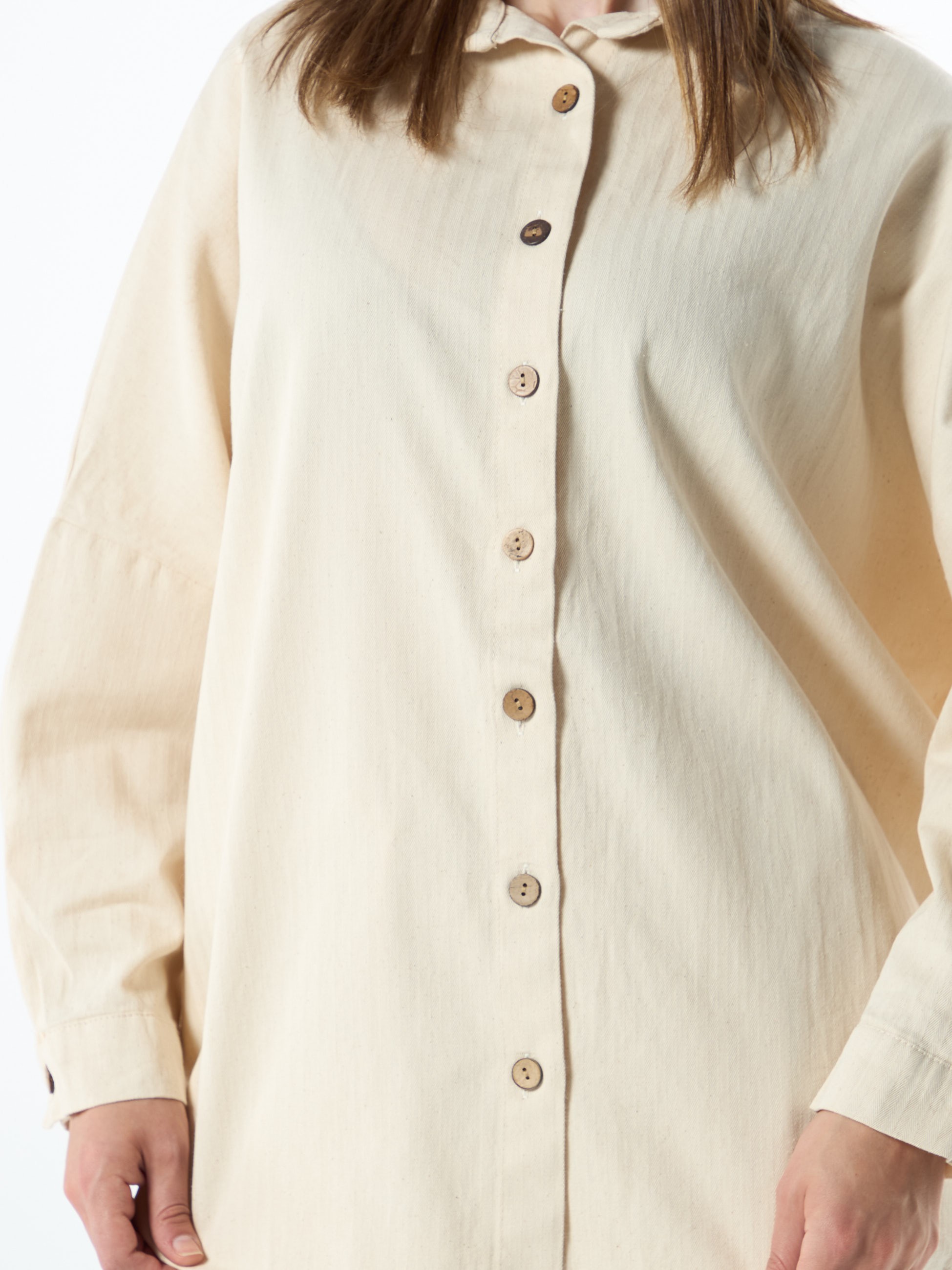 beige shirt with wooden buttons