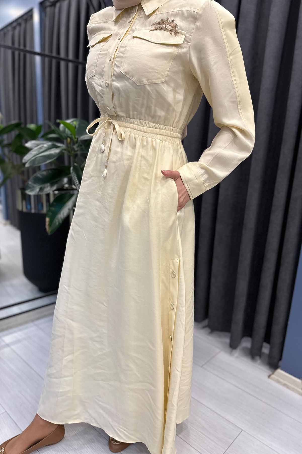 BELDEN BÜZGÜLÜ TEK CEBİ İŞLEMELİ TENCEL ELBİSE