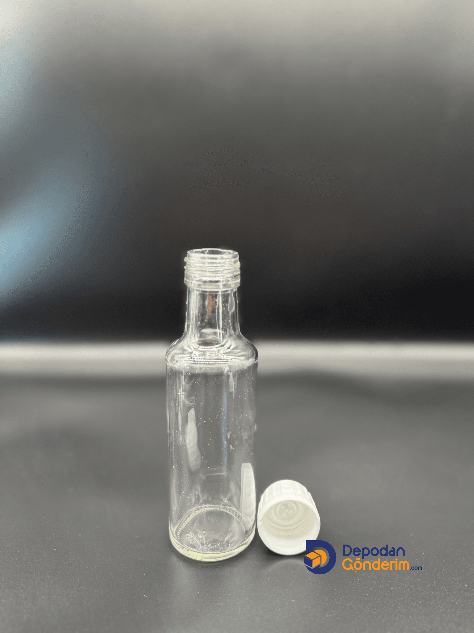 DP94 100cc DORİKA ŞEFFAF ŞİŞE- BEYAZ KİLİTLİ KAPAK 