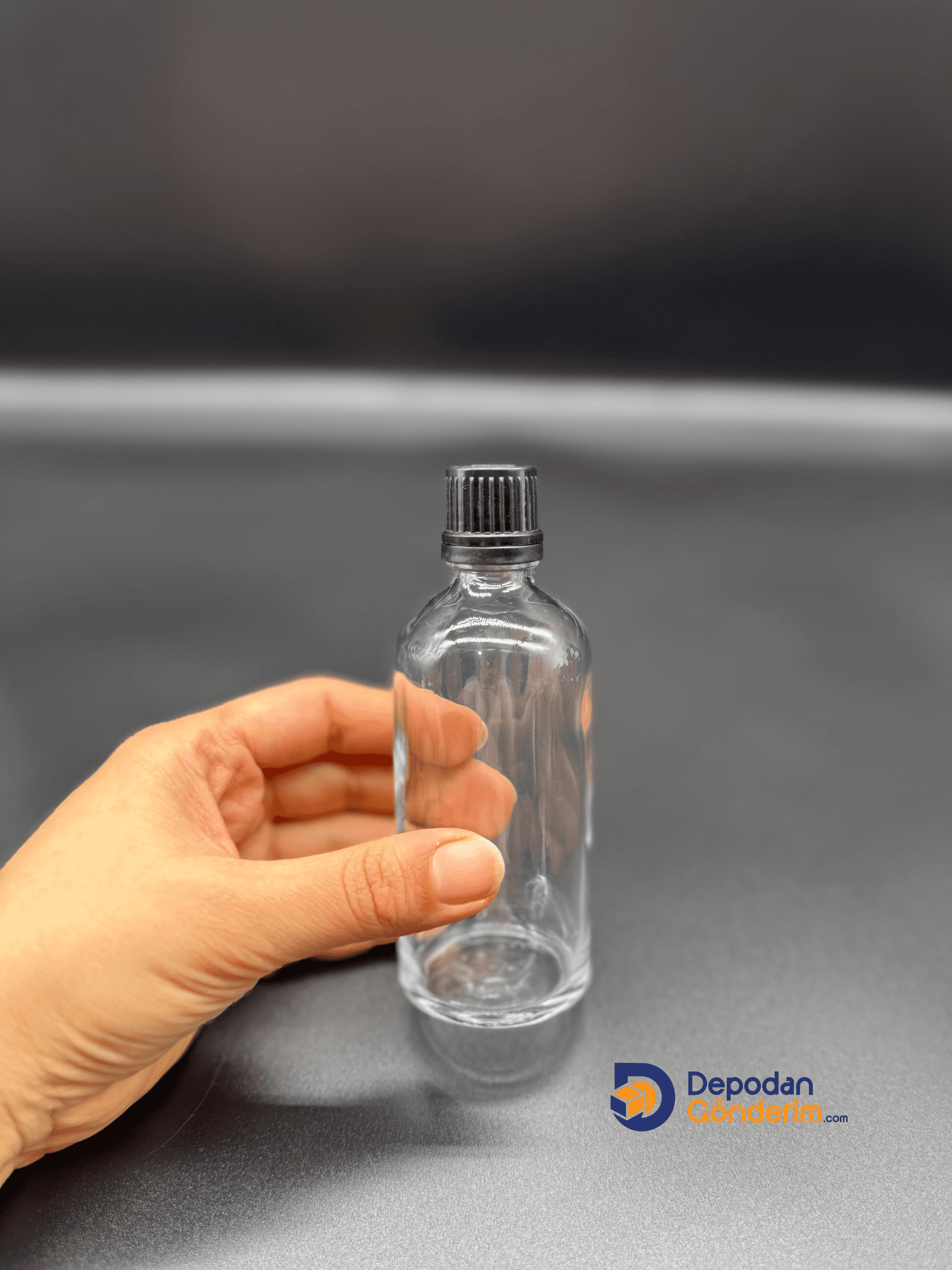 DP76 100cc ŞEFFAF ŞİŞE - SİYAH KİLİTLİ KAPAKLI 