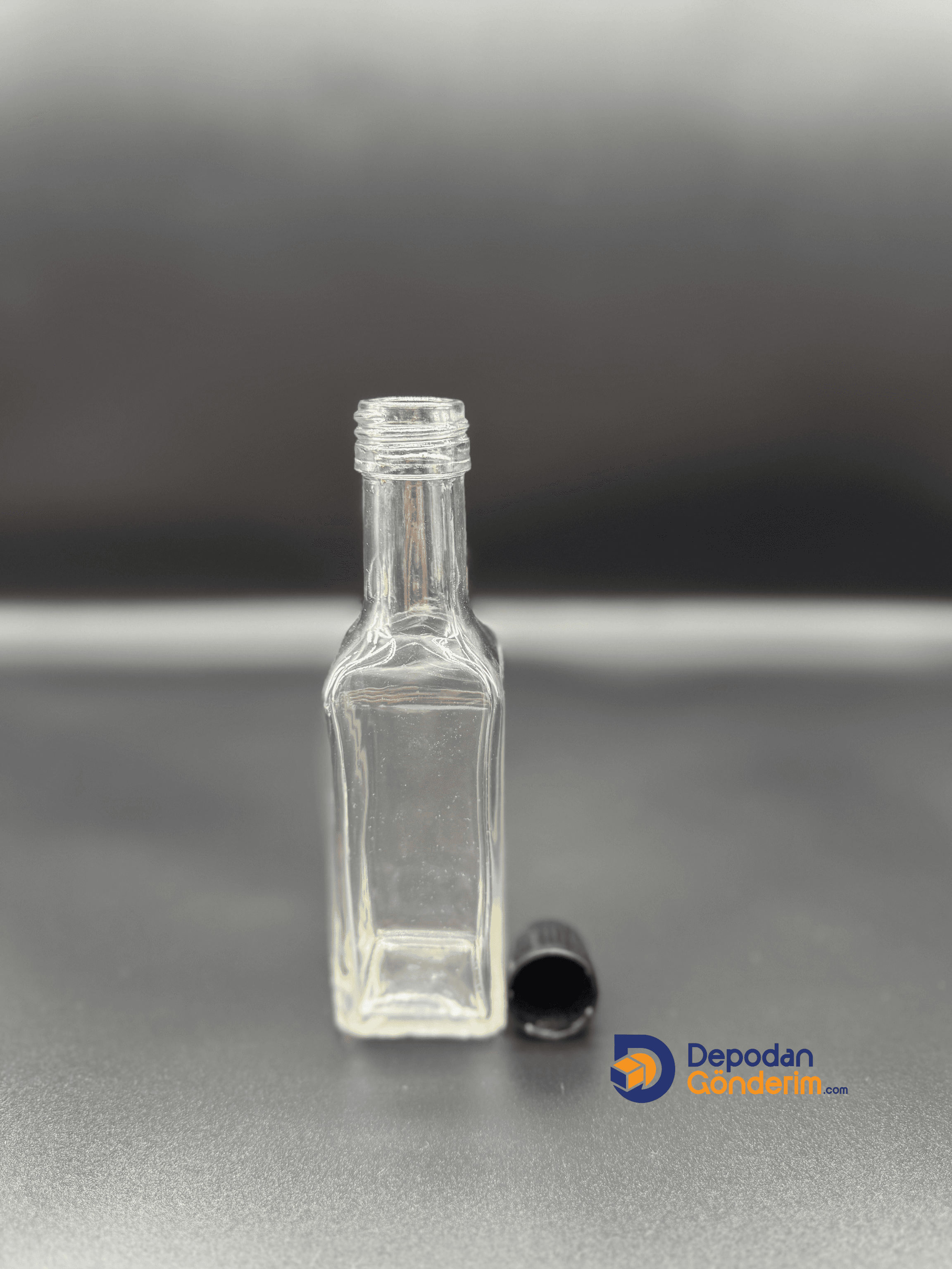 DP75 100cc ŞEFFAF MARASKE ŞİŞE - SİYAH KİLİTLİ KAPAKLI 