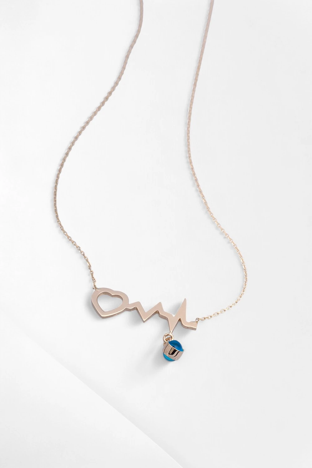 14 Ayar Altın Kalp Atışı Kolye: Aşkın Ritmini Taşıyan Nazar Boncuklu Zarif Tasarım 2,17 GR Ürün Kodu: KLY5458