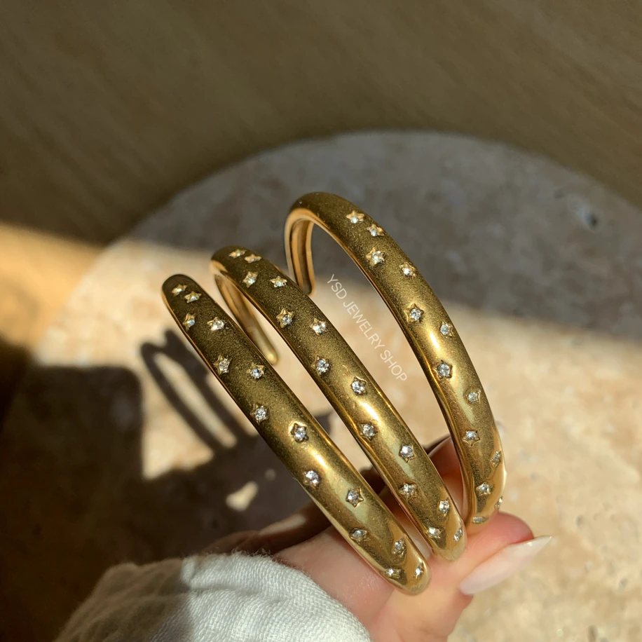 Çelik kristal taş yıldız işlemeli kelepçe