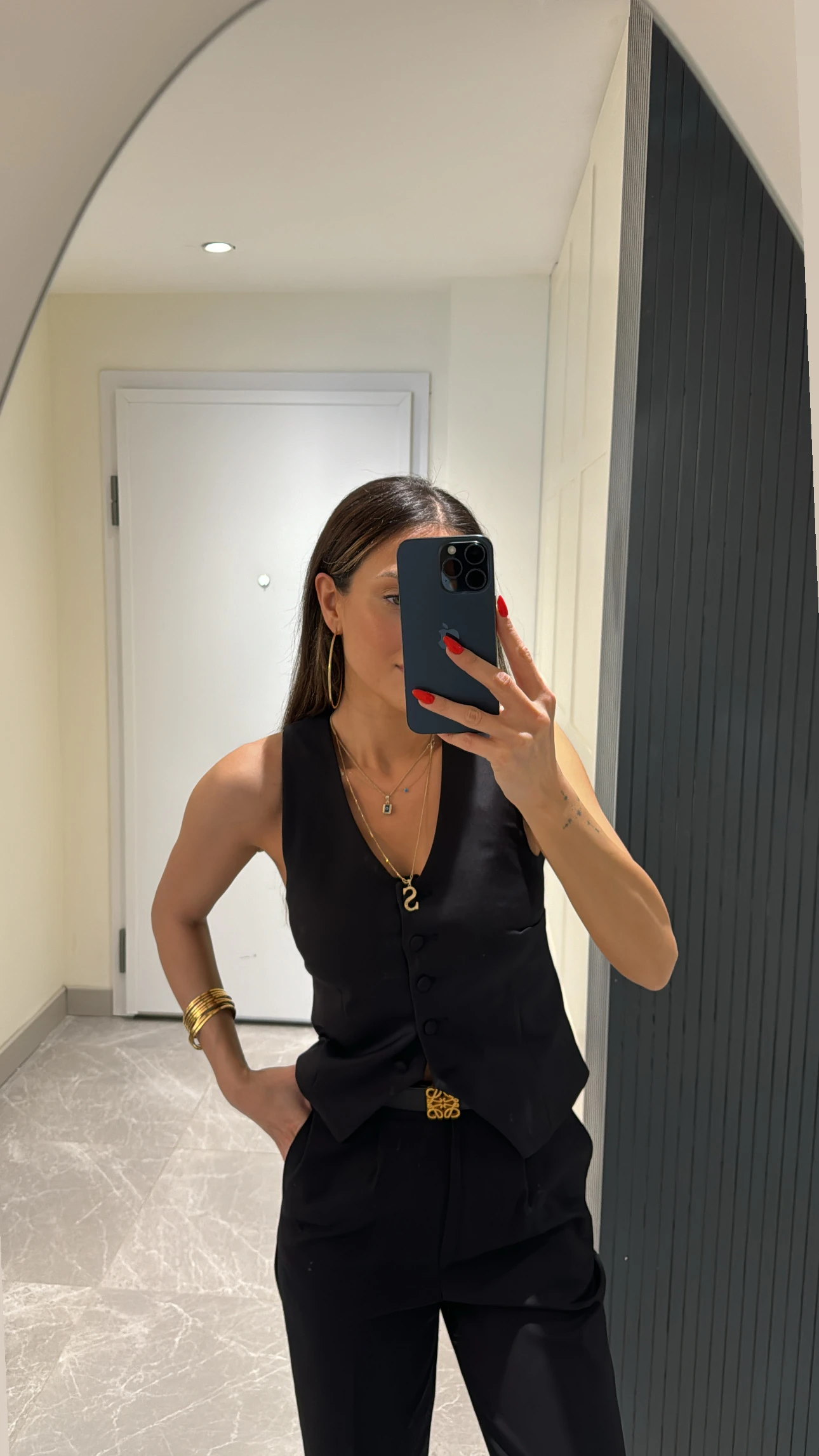 black button-detailed vest