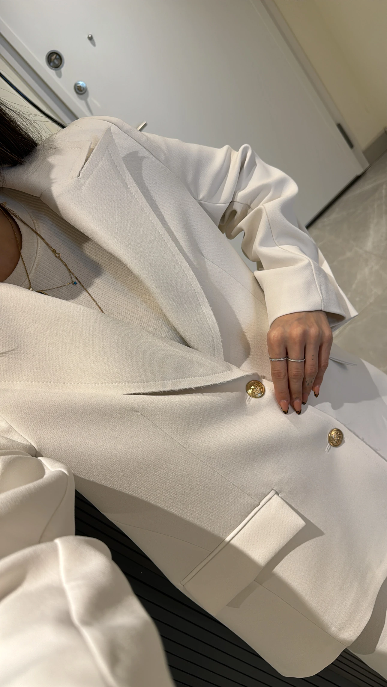 white satin fabric jacket with gold button details