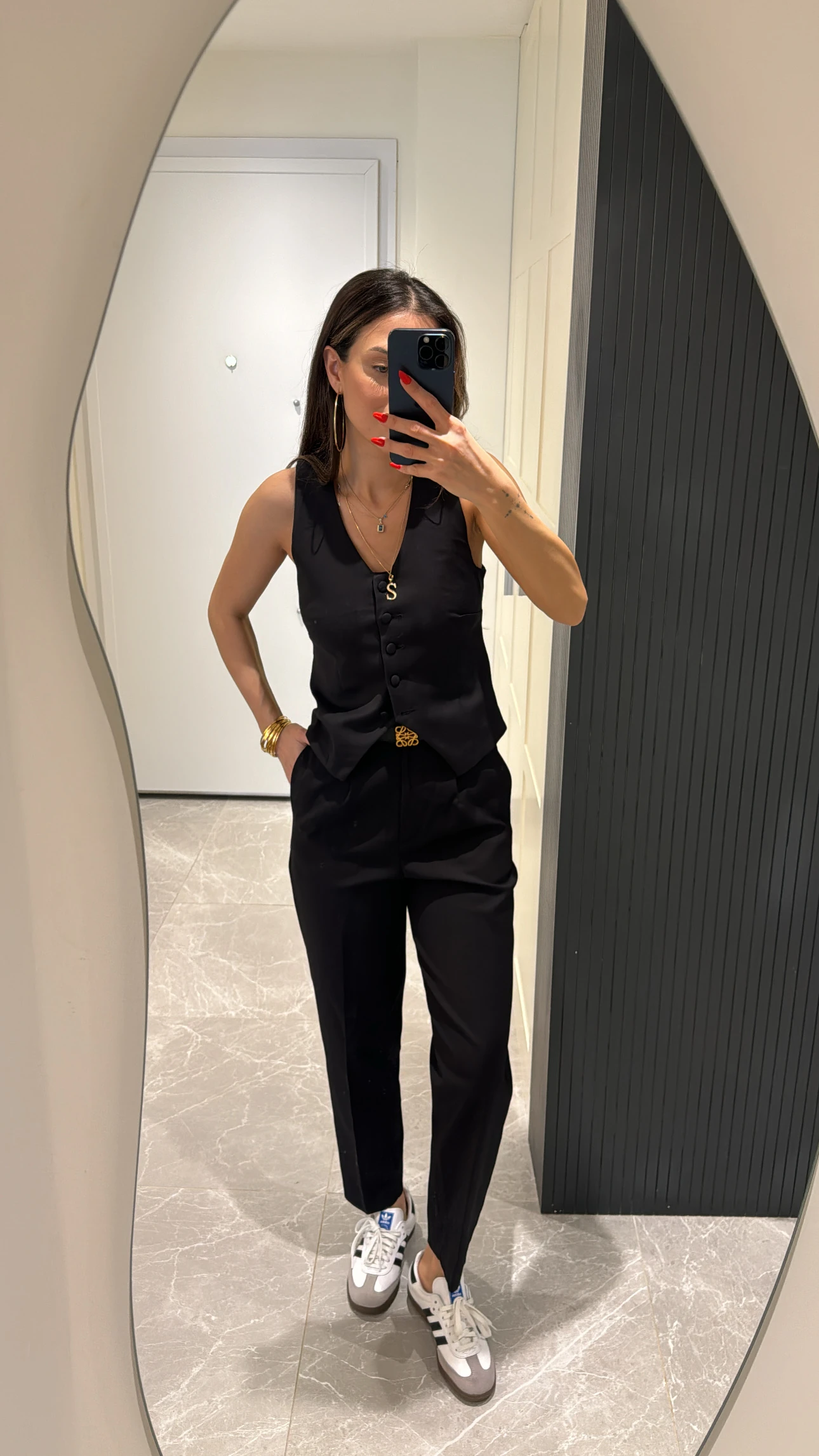 black button-detailed vest