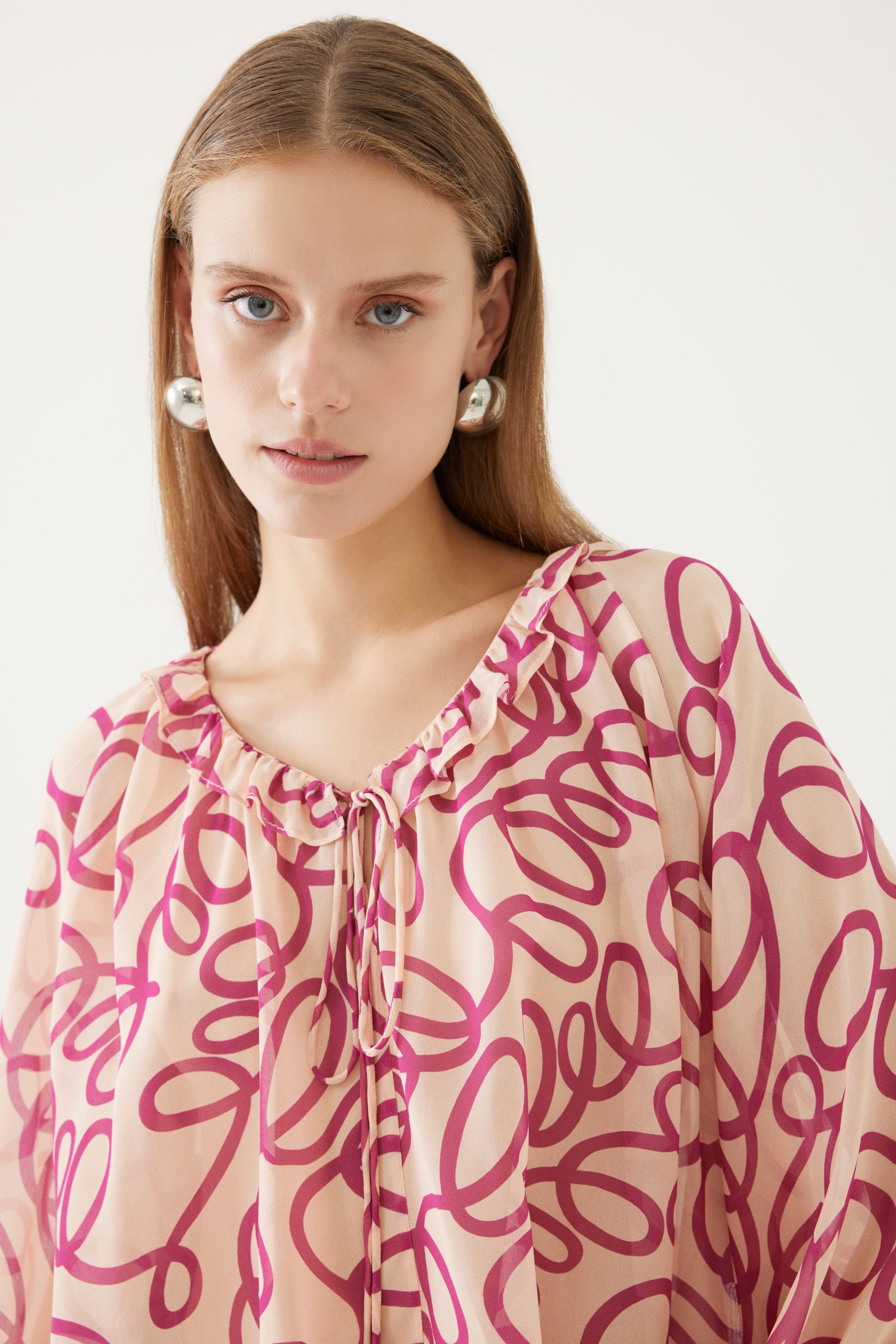 Collar Tie Detail and Patterned Blouse