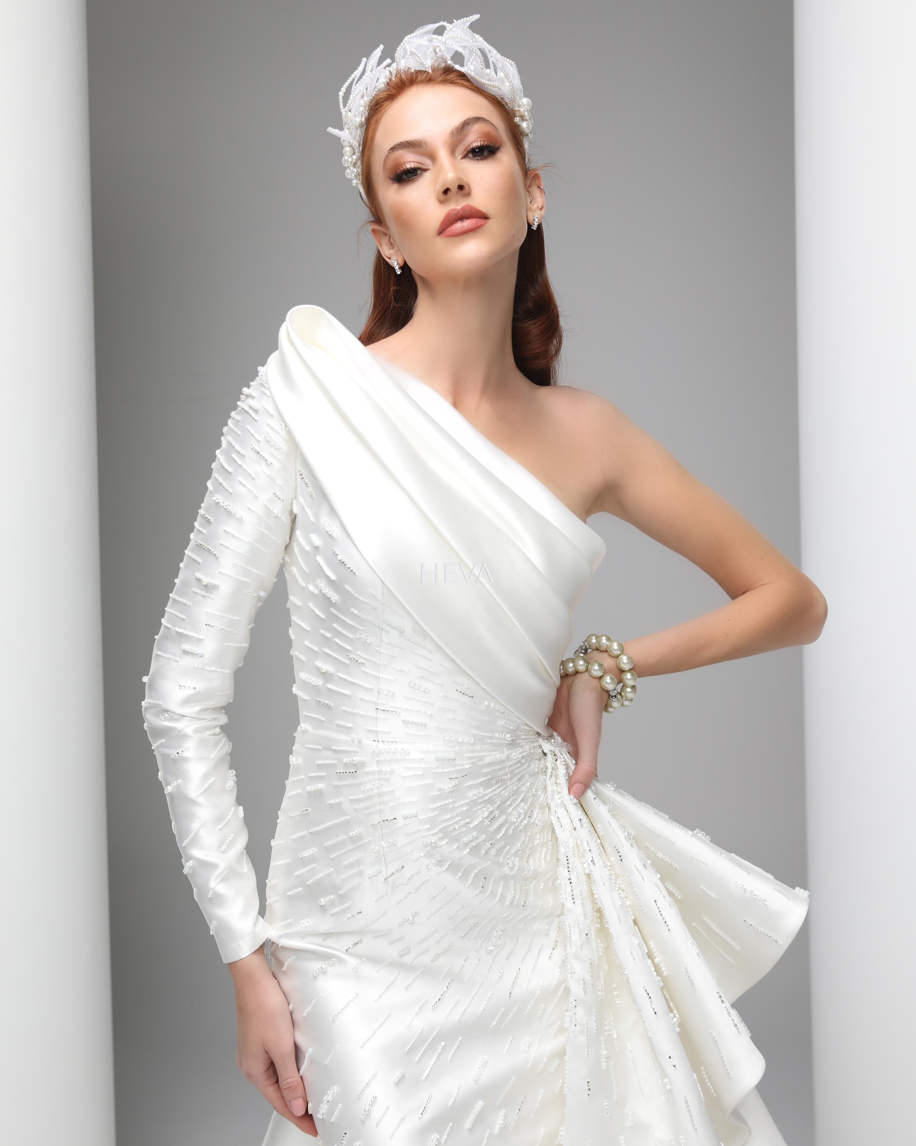 HV22010 - Asymmetrical Tail, One-Shoulder, One-Sleeved, Custom-Designed Wedding Gown with Draped Neckline and Fully Hand-Embroidered Crystal Stones in a Fishtail Model, Made of Silk Ziberline Fabric