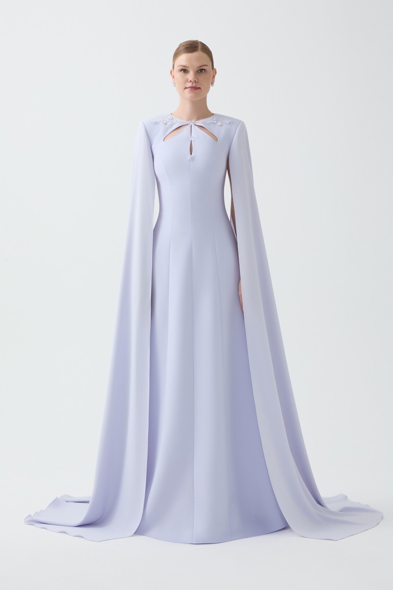 R83 - Keyhole Neckline, Padded Shoulders, Hand-Embroidered Collar and Front, Long Cape Sleeves, Paneled A-Line Design, Full-Length Dress