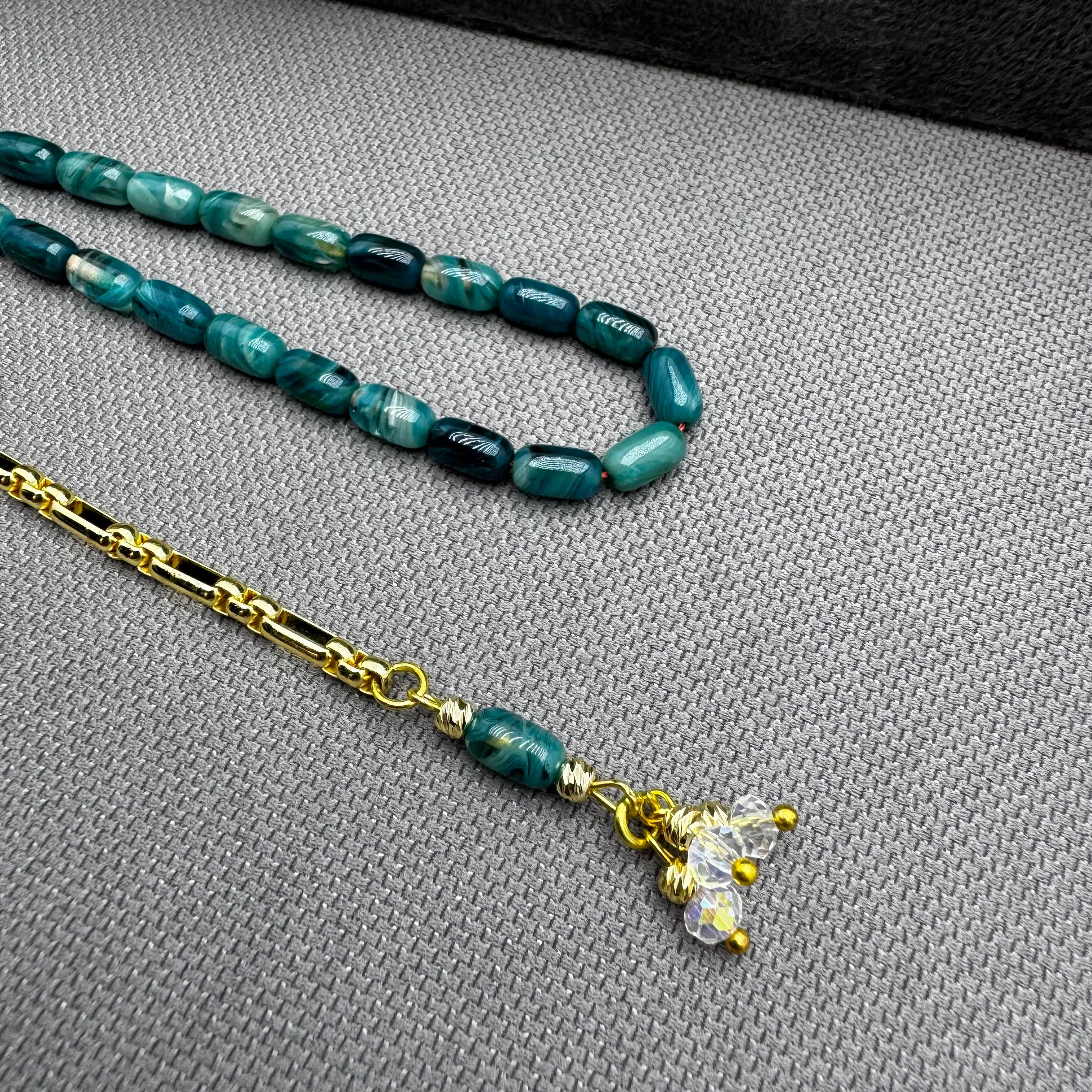 Özel Dizayn Pirinç Püsküllü Okyanus Mavi Hareli Bilek Boy Kehribar Tespih