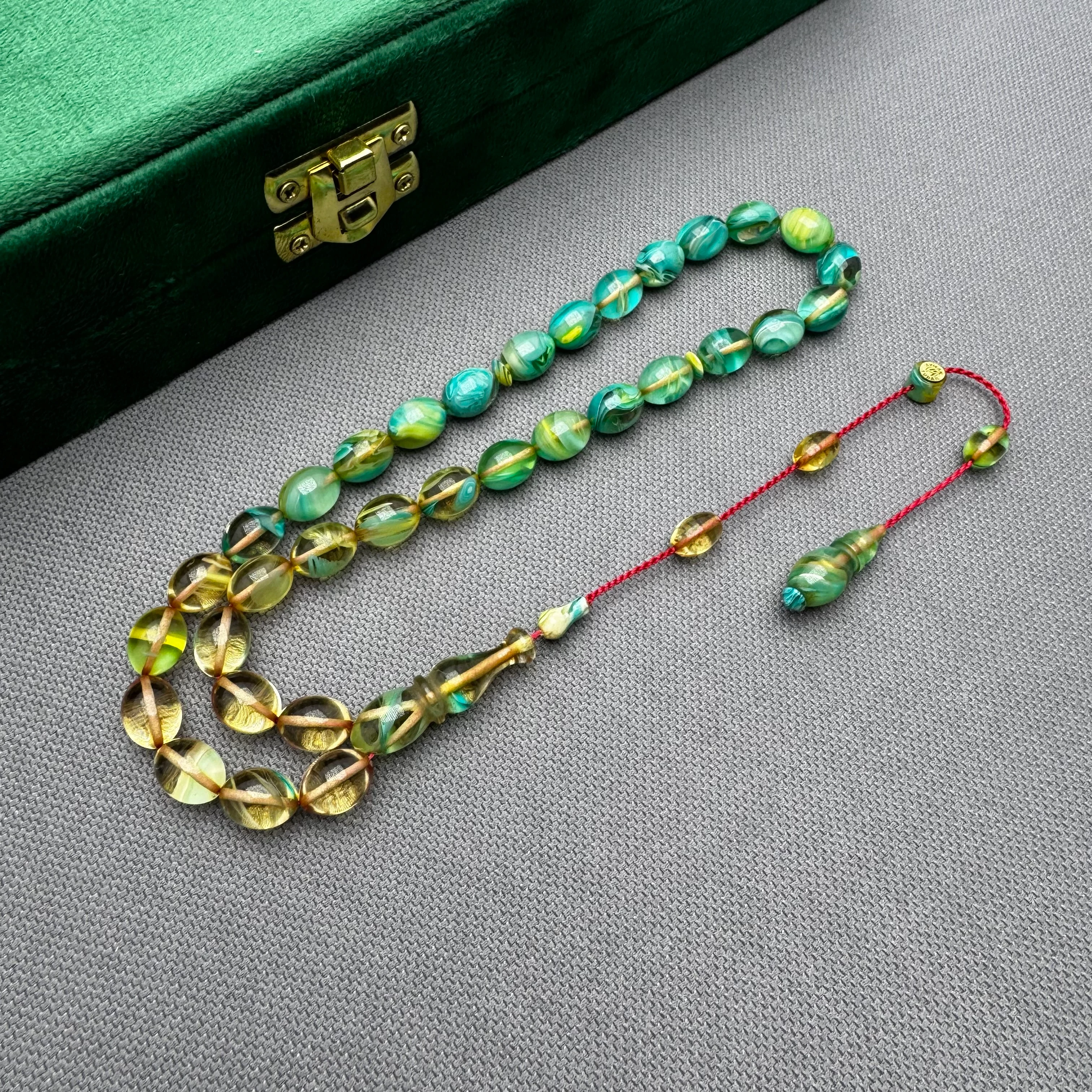 Ayhan TURAN Usta İşçilikli Şeffaf Turkuaz Renk Süzmeli Beyzi Kesim Yoğun Hareli Ateş Kehribar Tespih