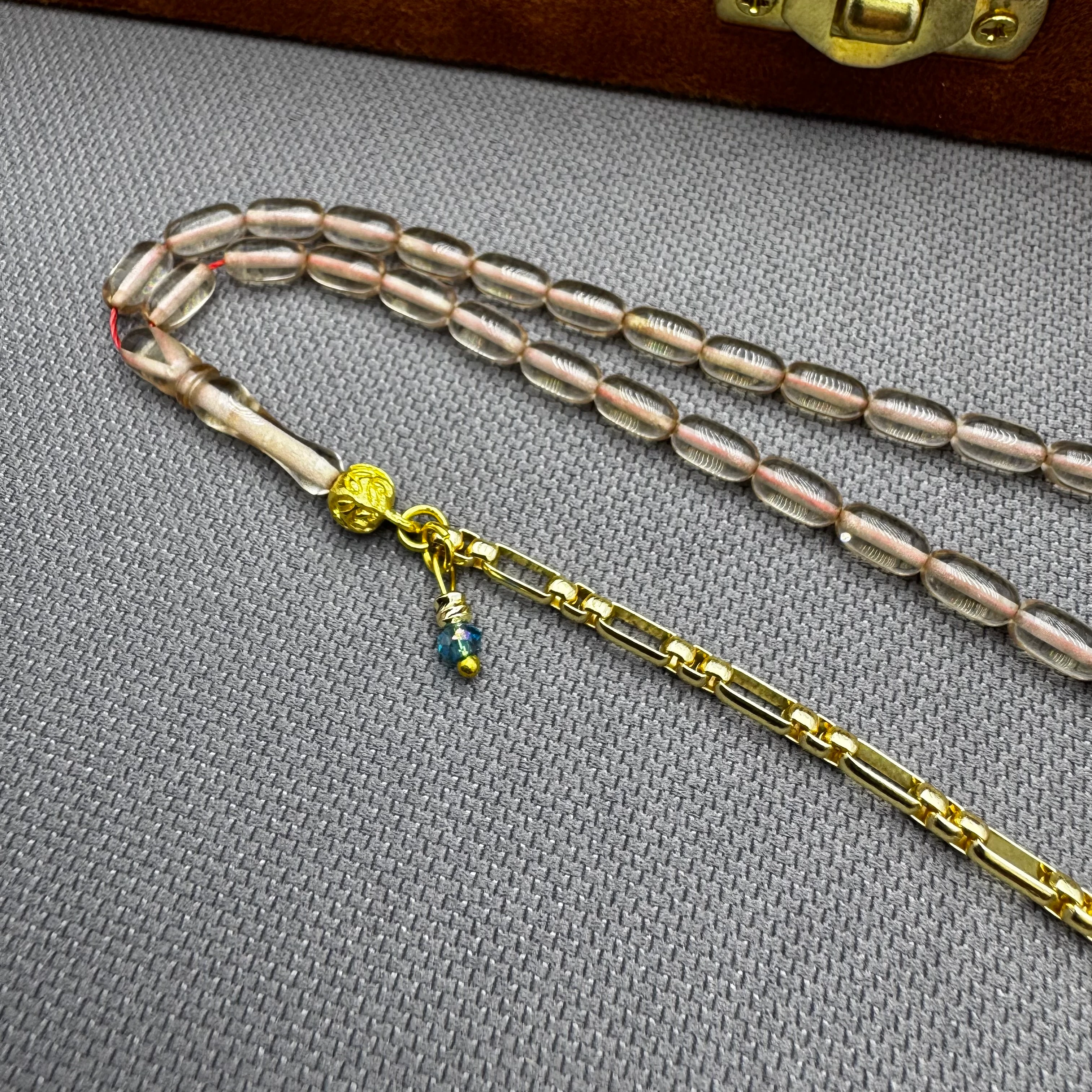 Özel Dizayn Pirinç Püsküllü Şeffaf Bilek Boy Sıkma Kehribar Tespih