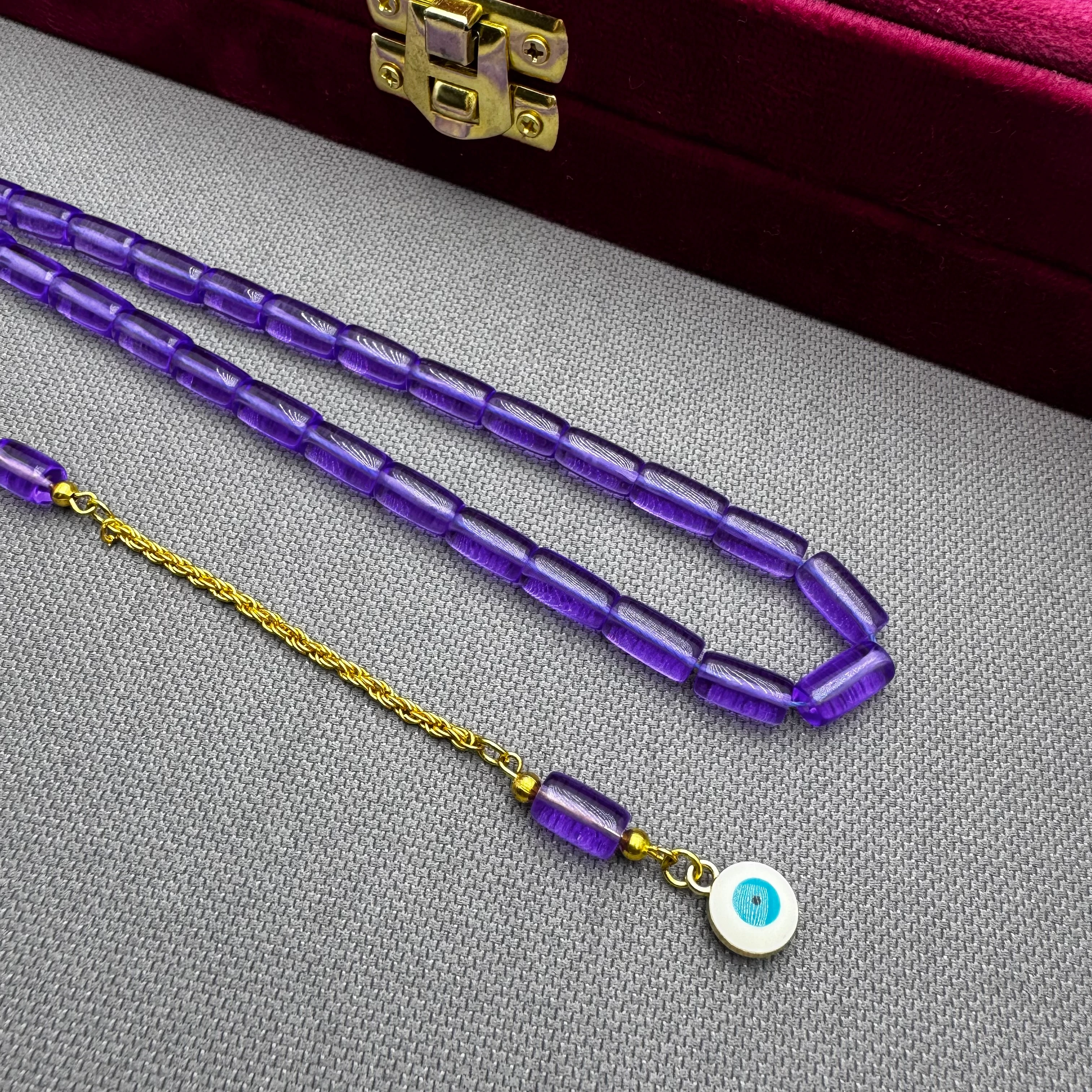 Nazar Boncuğu Detaylı Pirinç Püsküllü Bilek Boy Kapsül Kesim Lila Rengi Uçak Camı Tespih