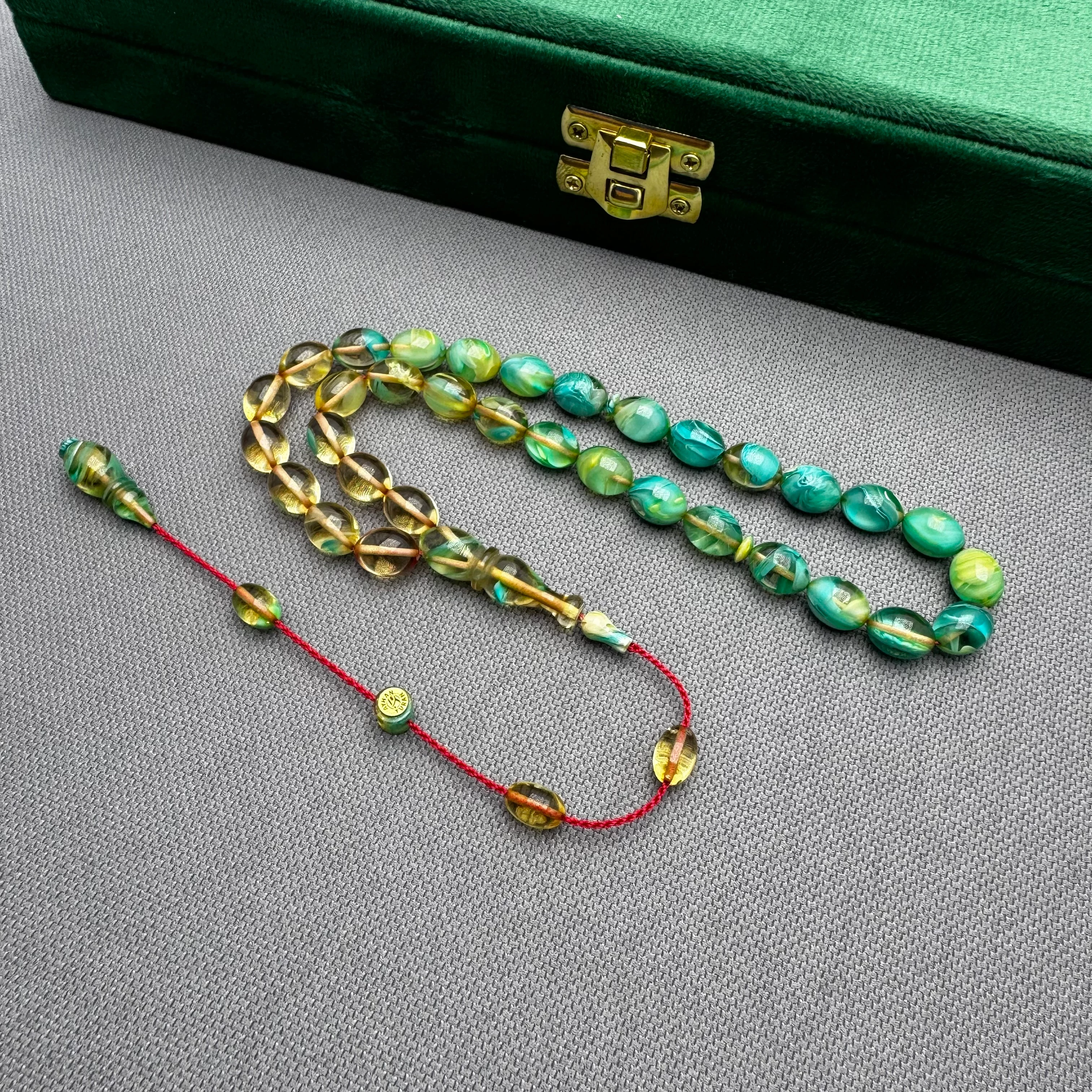 Ayhan TURAN Usta İşçilikli Şeffaf Turkuaz Renk Süzmeli Beyzi Kesim Yoğun Hareli Ateş Kehribar Tespih