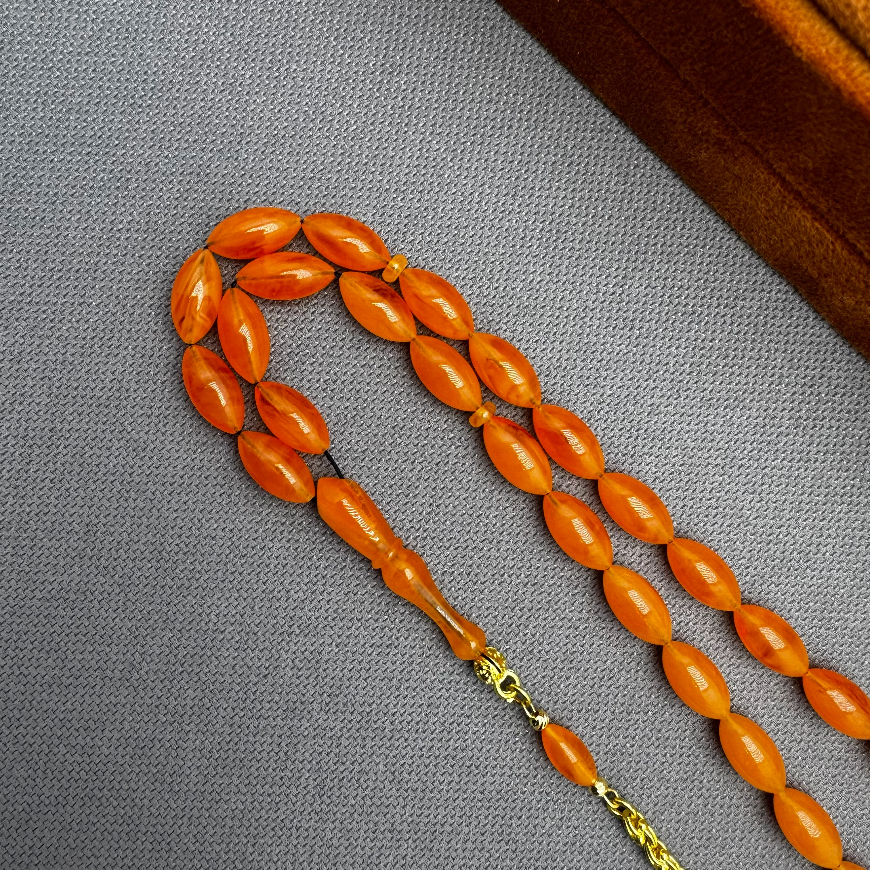 Usta İşçilikli 925 Ayar Gümüş Püsküllü Turuncu Hareli Alman Bakalit Tespih