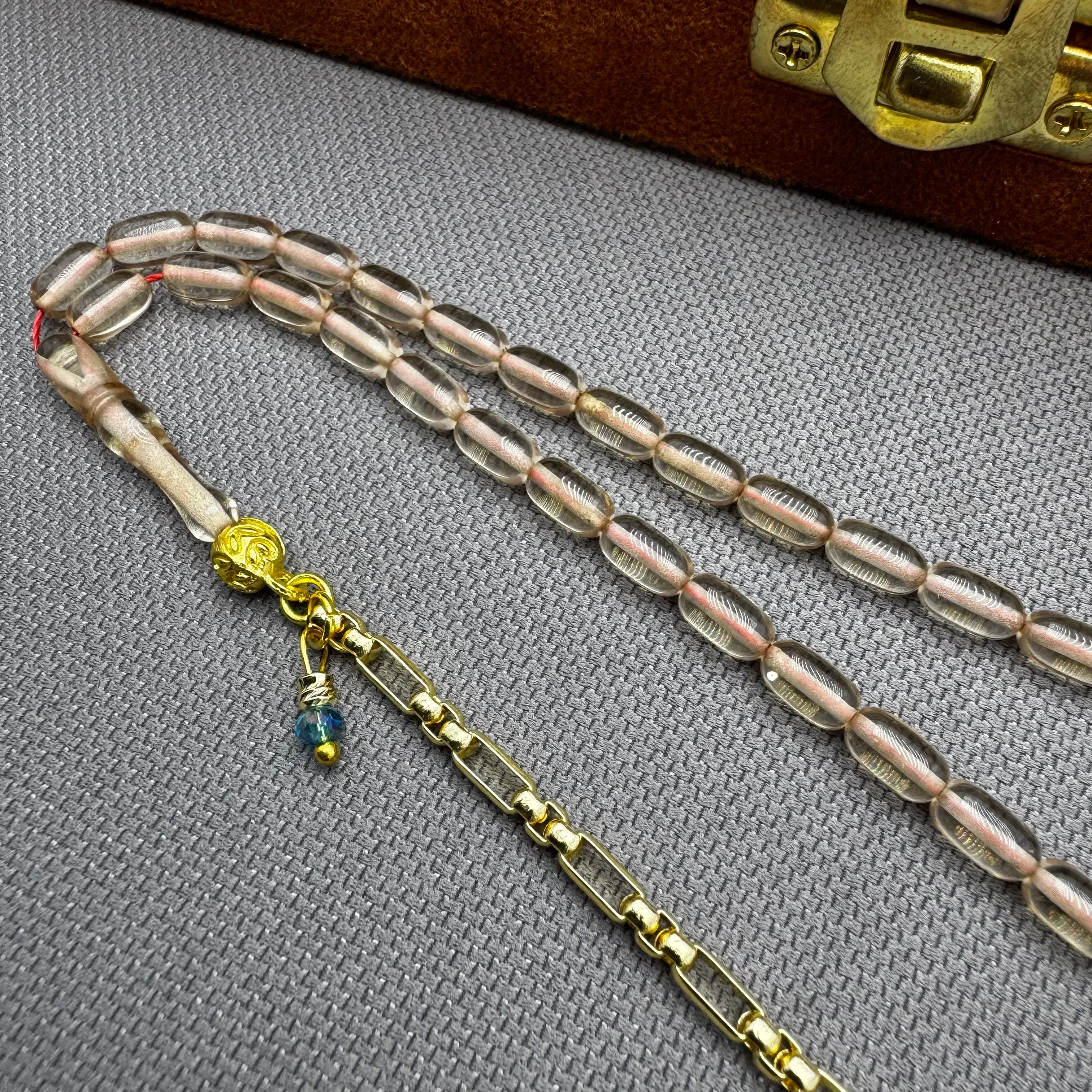 Özel Dizayn Pirinç Püsküllü Şeffaf Bilek Boy Sıkma Kehribar Tespih