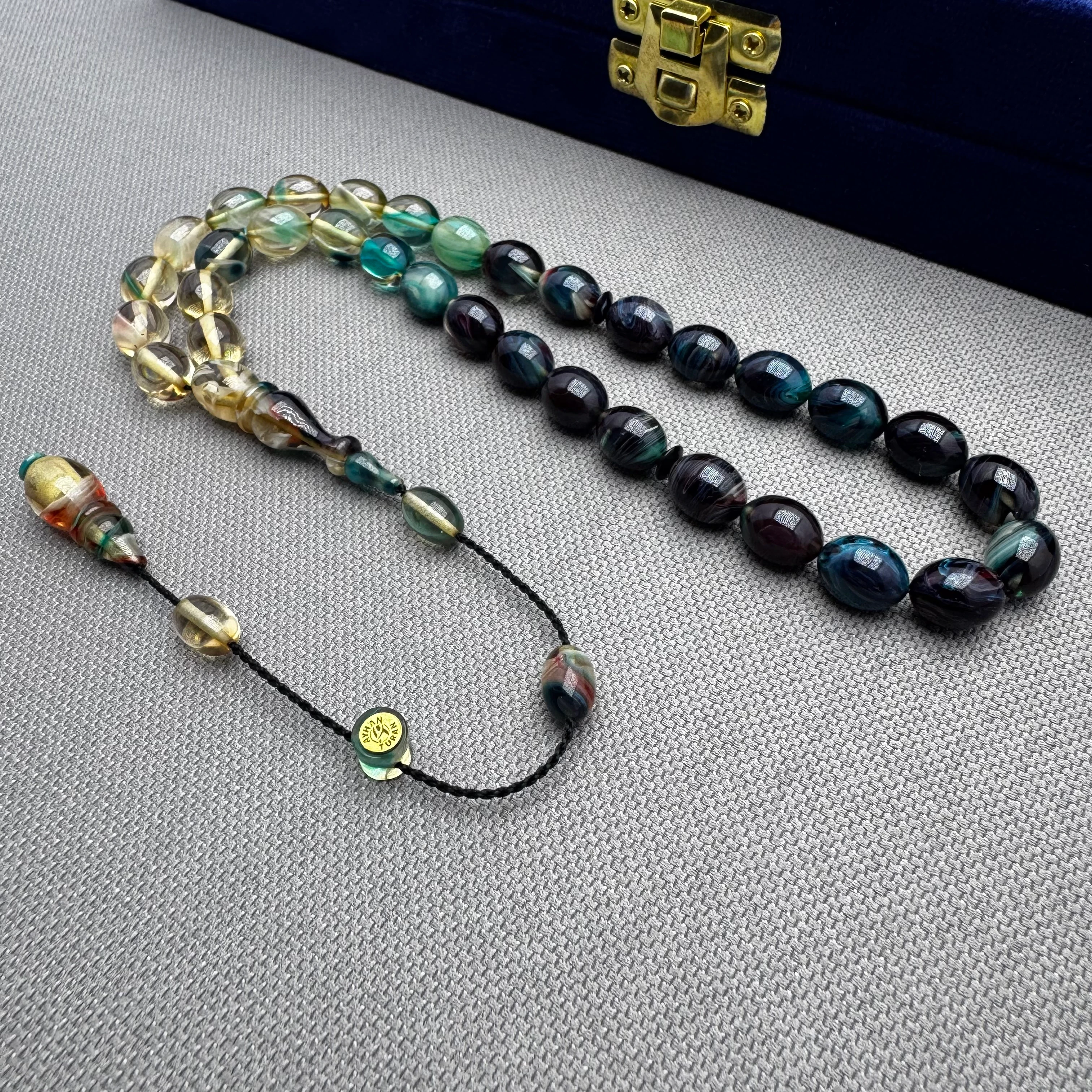 Ayhan TURAN Usta İşçilikli Lacivert Şeffaf Yoğun Hareli Beyzi Kesim Ateş Kehribar Tespih