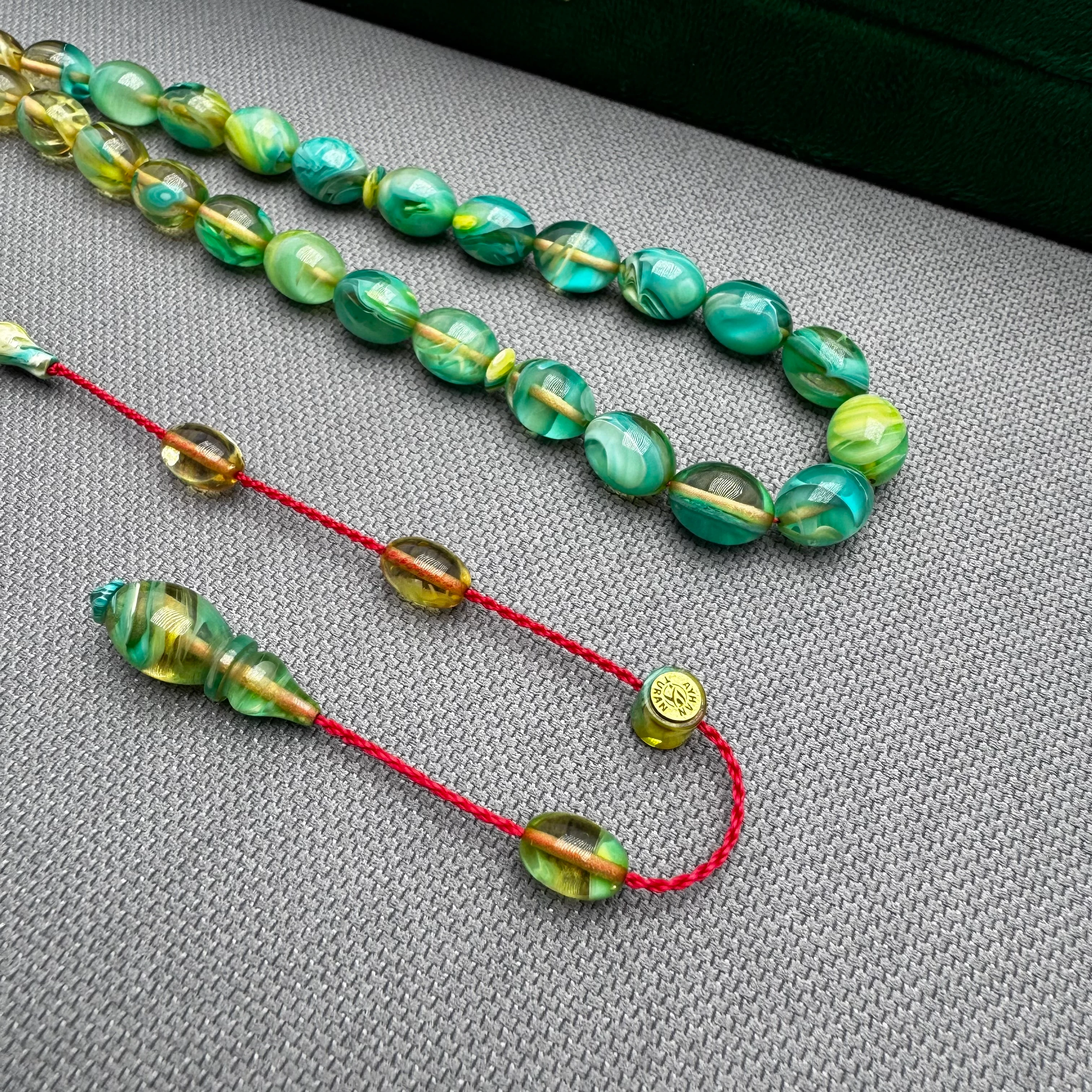 Ayhan TURAN Usta İşçilikli Şeffaf Turkuaz Renk Süzmeli Beyzi Kesim Yoğun Hareli Ateş Kehribar Tespih