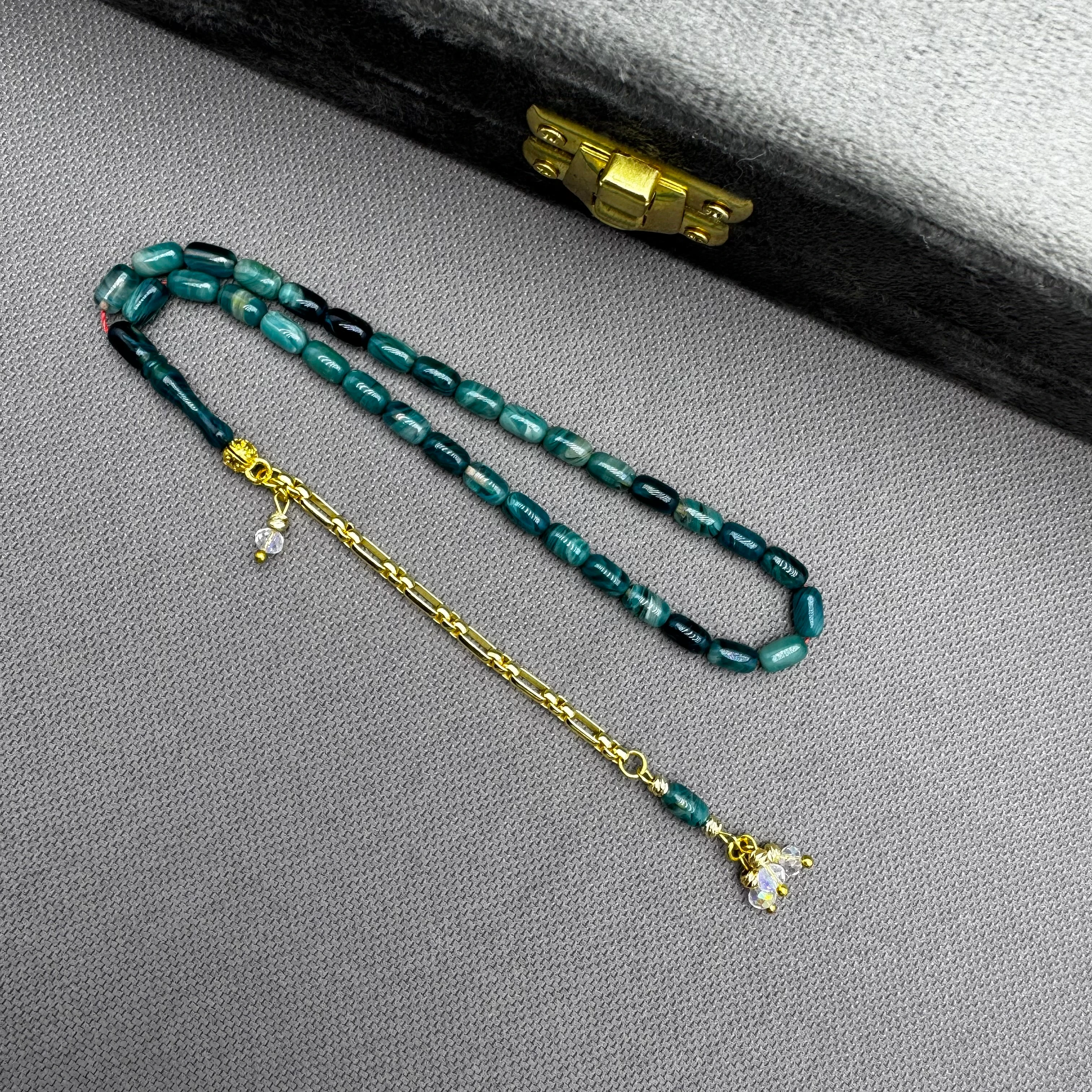 Özel Dizayn Pirinç Püsküllü Okyanus Mavi Hareli Bilek Boy Kehribar Tespih