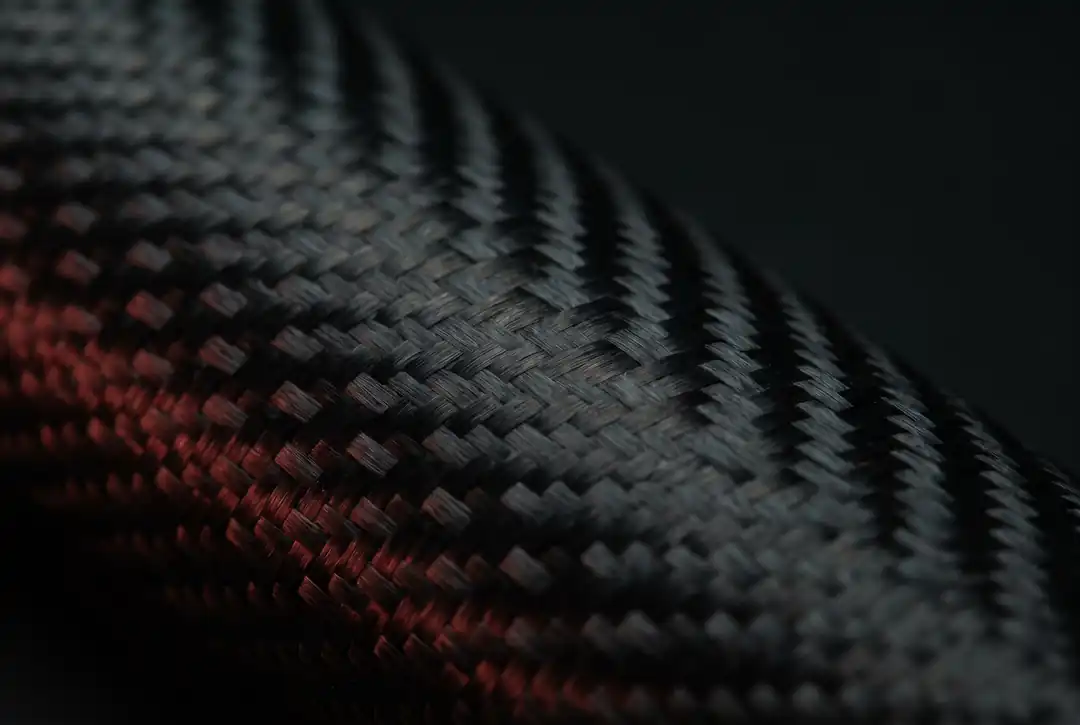 Matte: a light-swallowing velvety weave, no mirror reflection — the basis of the “stealth” look.