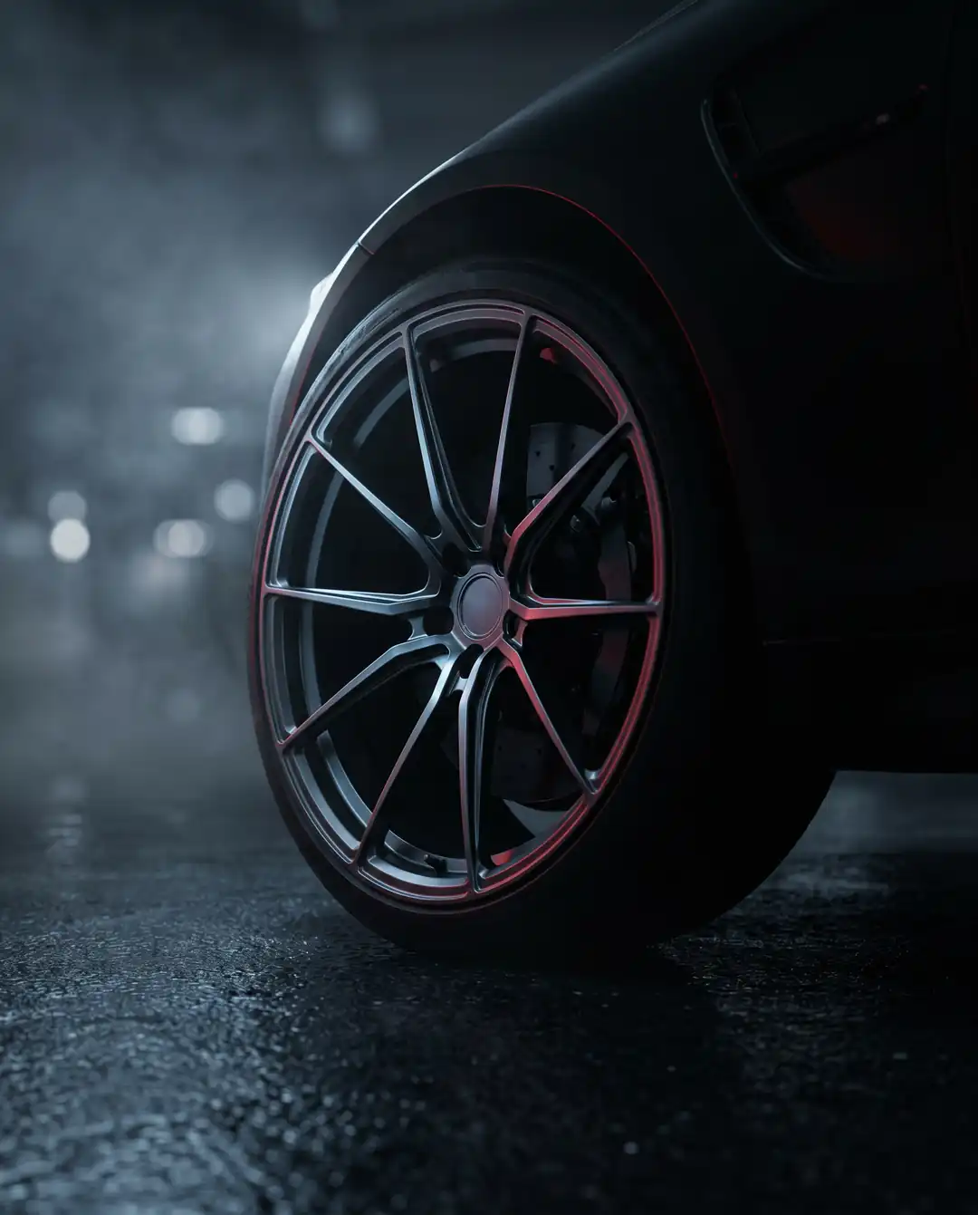 A lightweight forged wheel on the car's front corner.