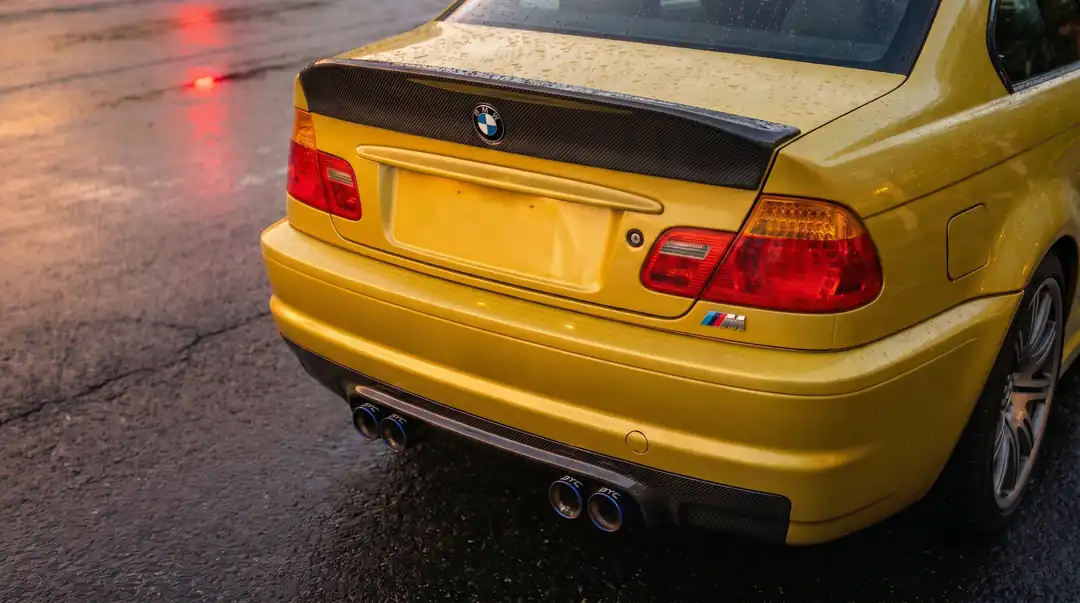 A carbon rear diffuser and quad titanium tips laser-etched “BYC”&nbsp; carbon ducktail on the trunk lid.