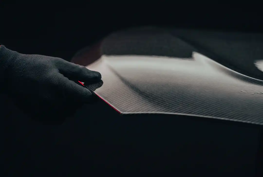 The hood is the biggest panel on the car, yet in carbon it's remarkably light — and that weight comes off the very front.