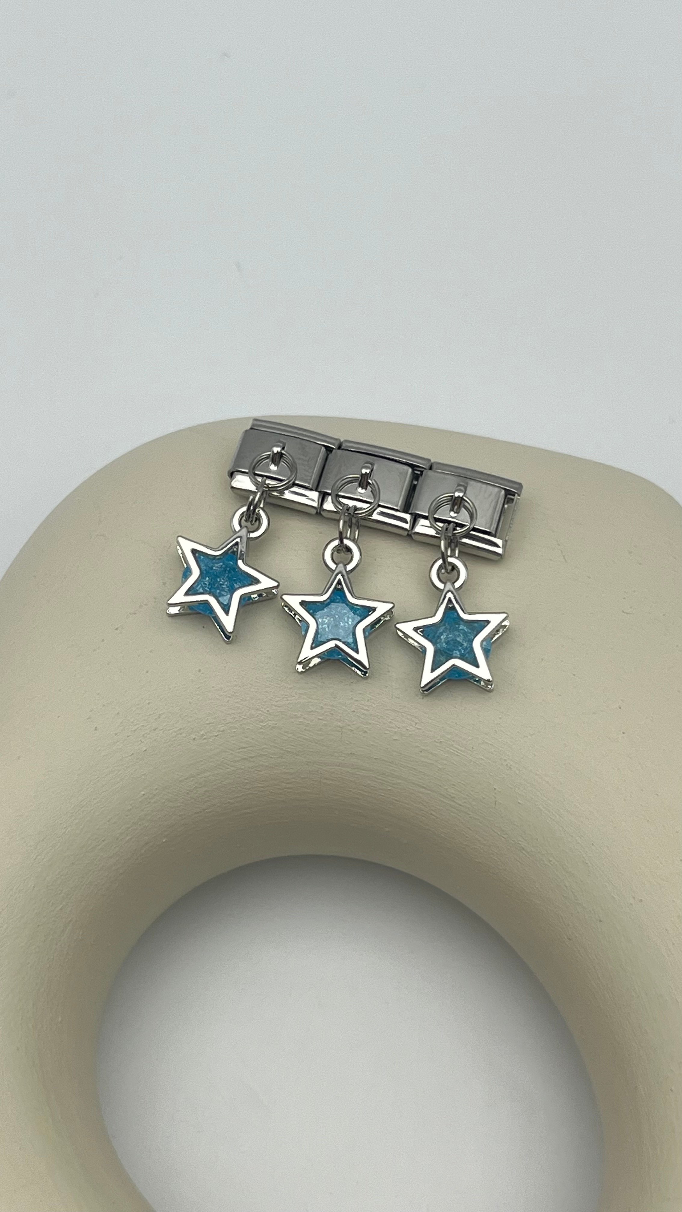 nomi charm