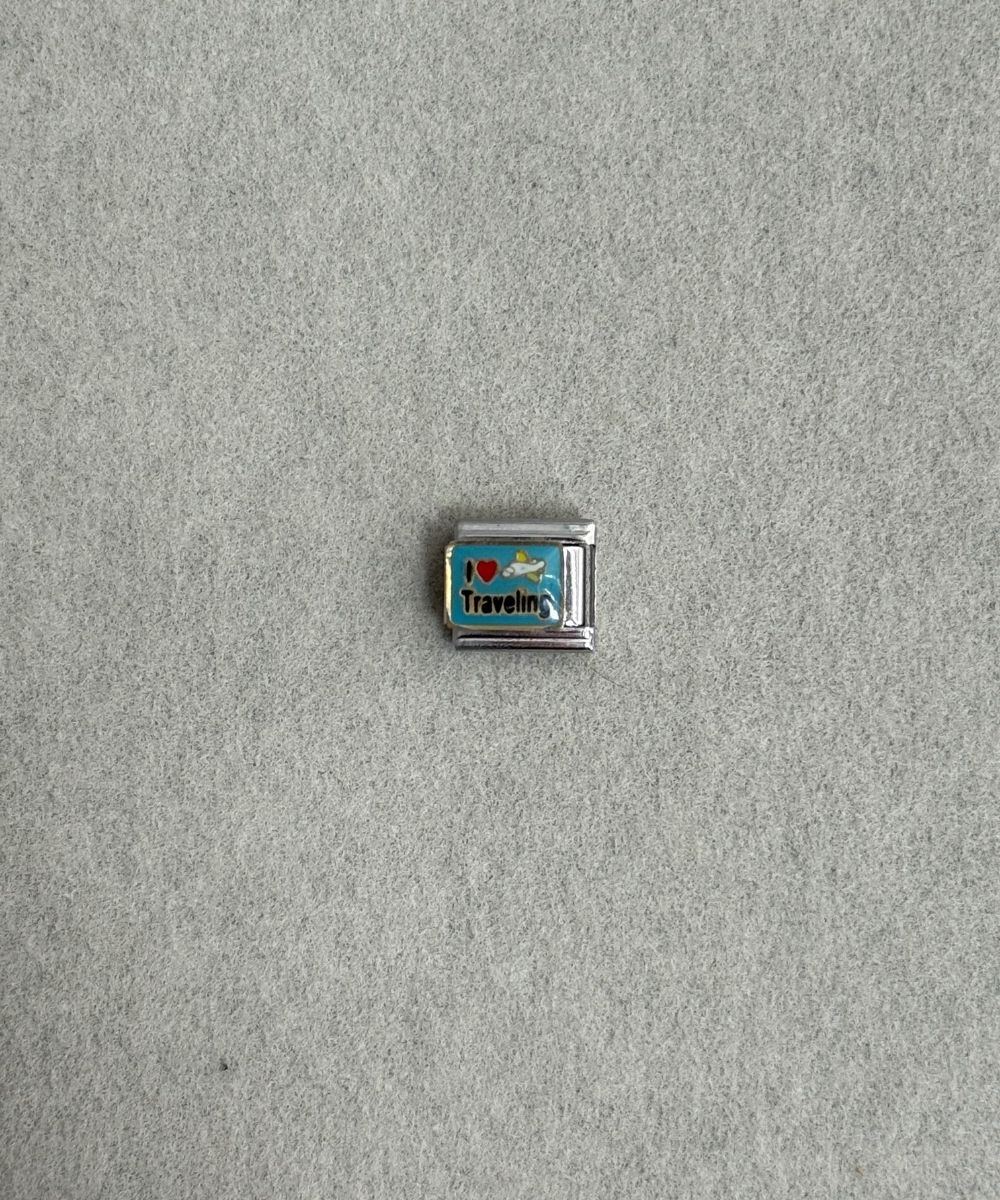 Nomi Travel Charm