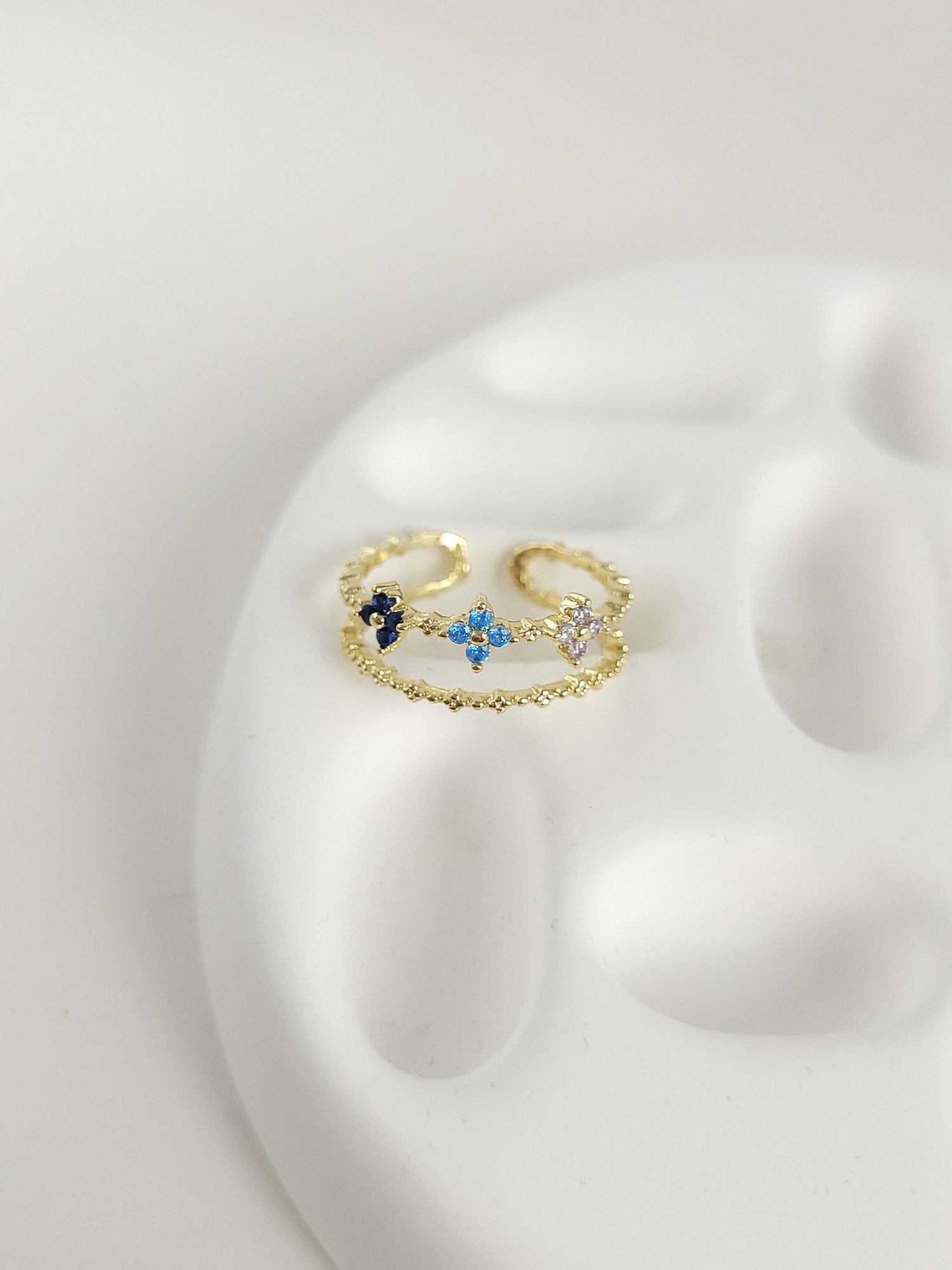 Double Line Floral Ring with blue Stones