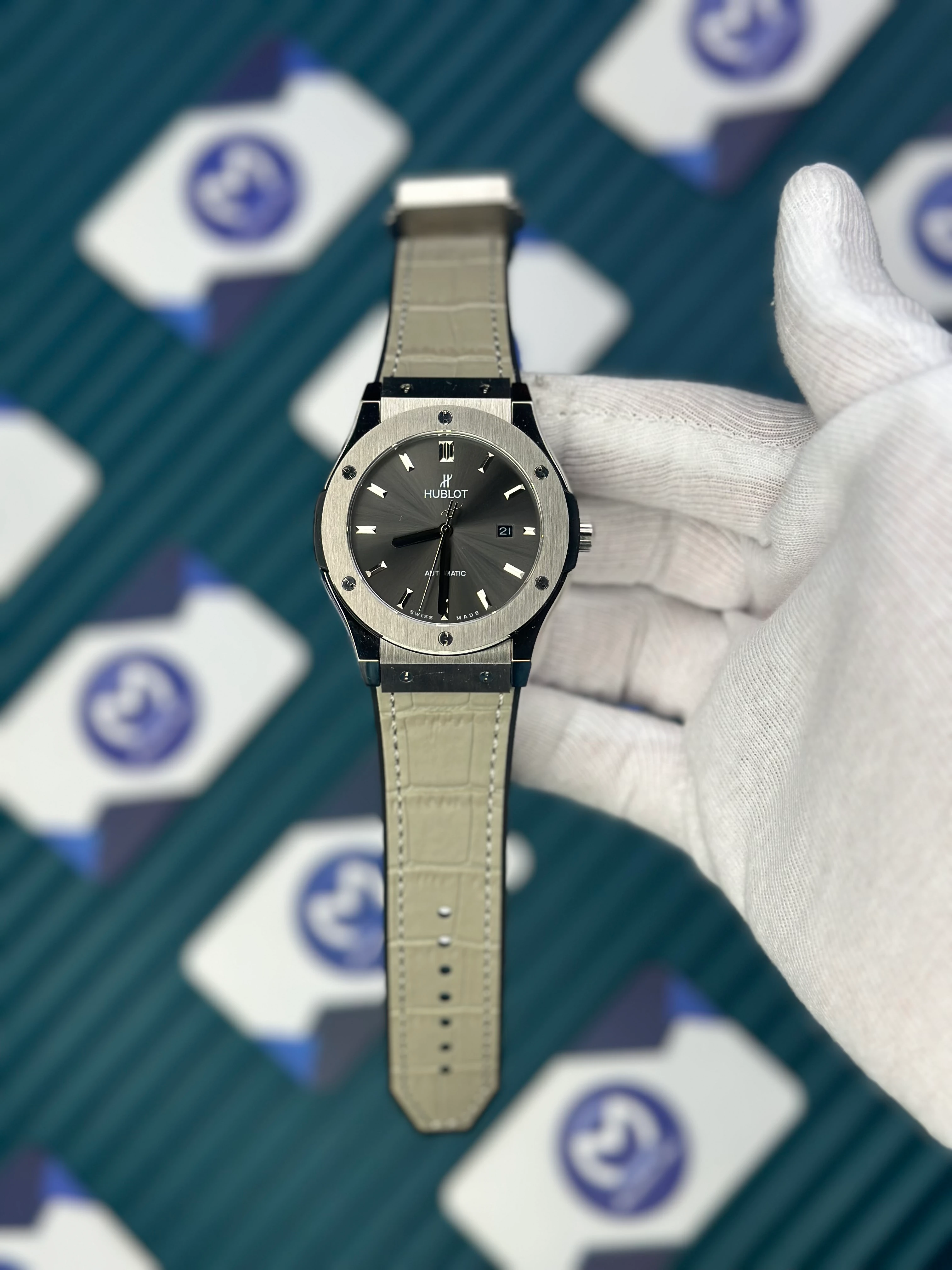 HUBLOT GENEVE AUTOMATIC NAVY GREY DIAL AND CASE GREY LEATHER CORD 