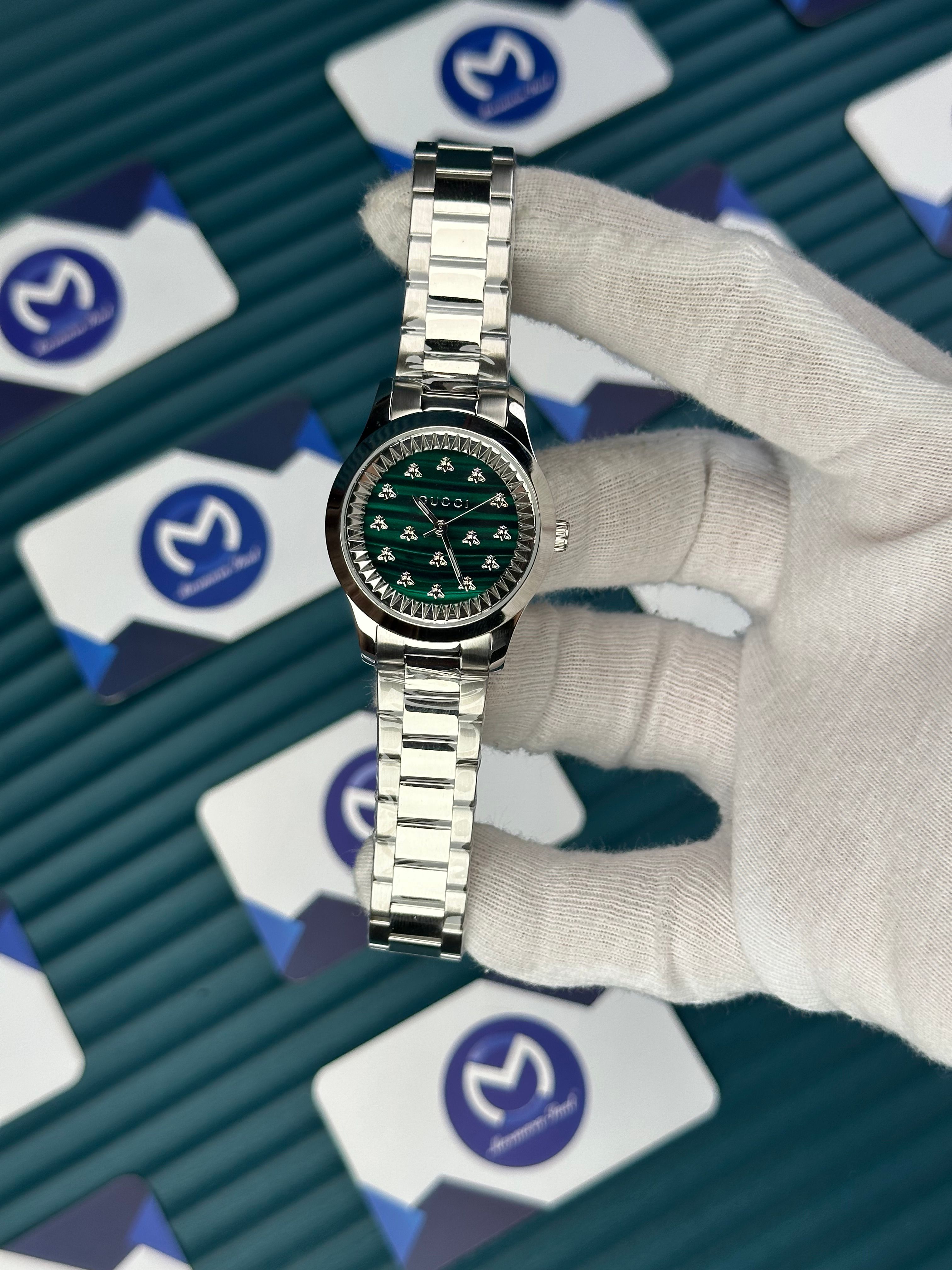 GUCCI WOMAN GREEN DIAL BUTTERFLY MOTIF SILVER