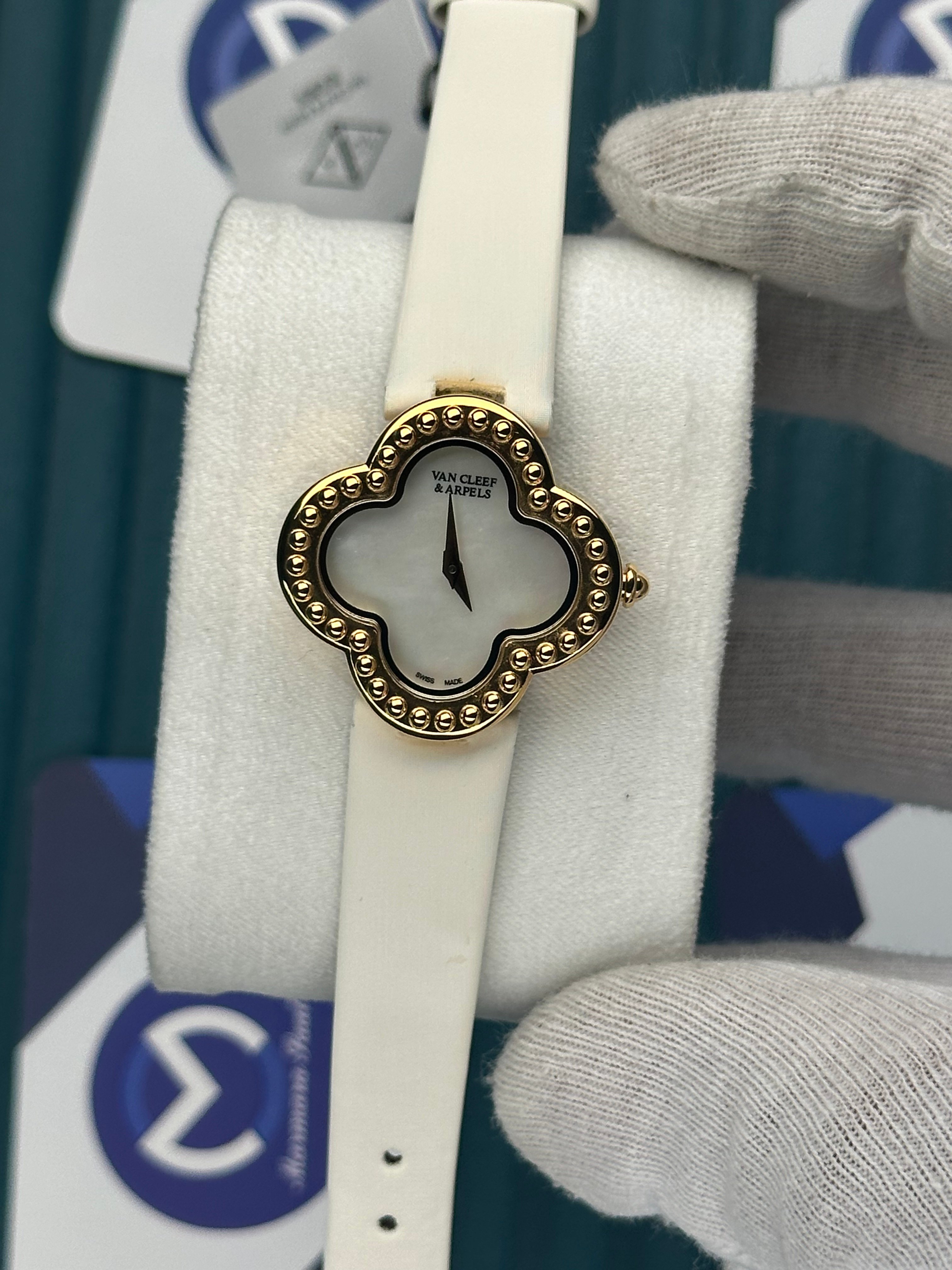 VAN CLEEF & ARPELS WHITE DIAL DIAMOND BEZEL GOLD CASE WHITE LEATHER CORD