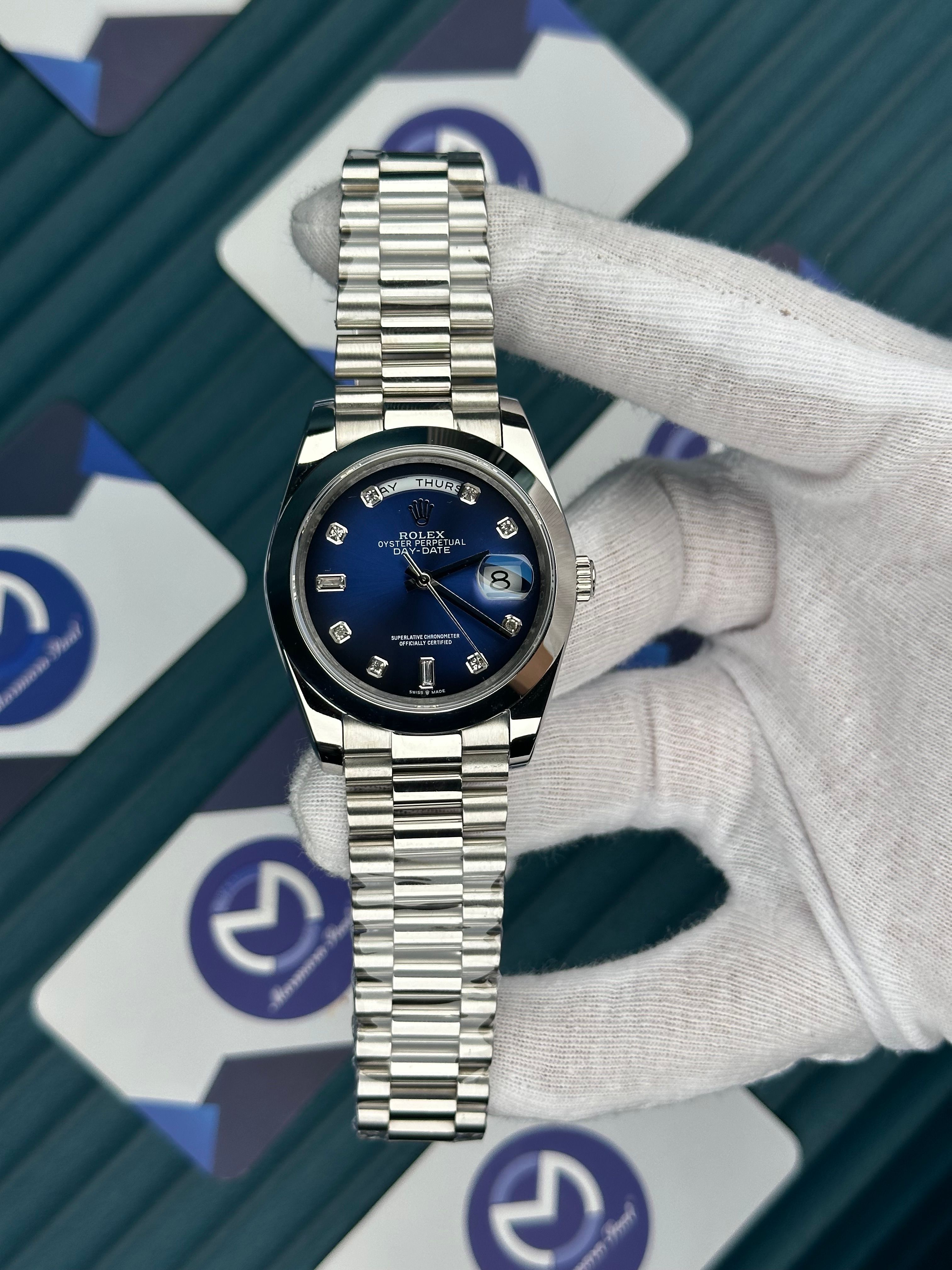 ROLEX DAY-DATE BLUE DIAL OVAL BEZEL DIAMOND INDEX SILVER PRESIDENT