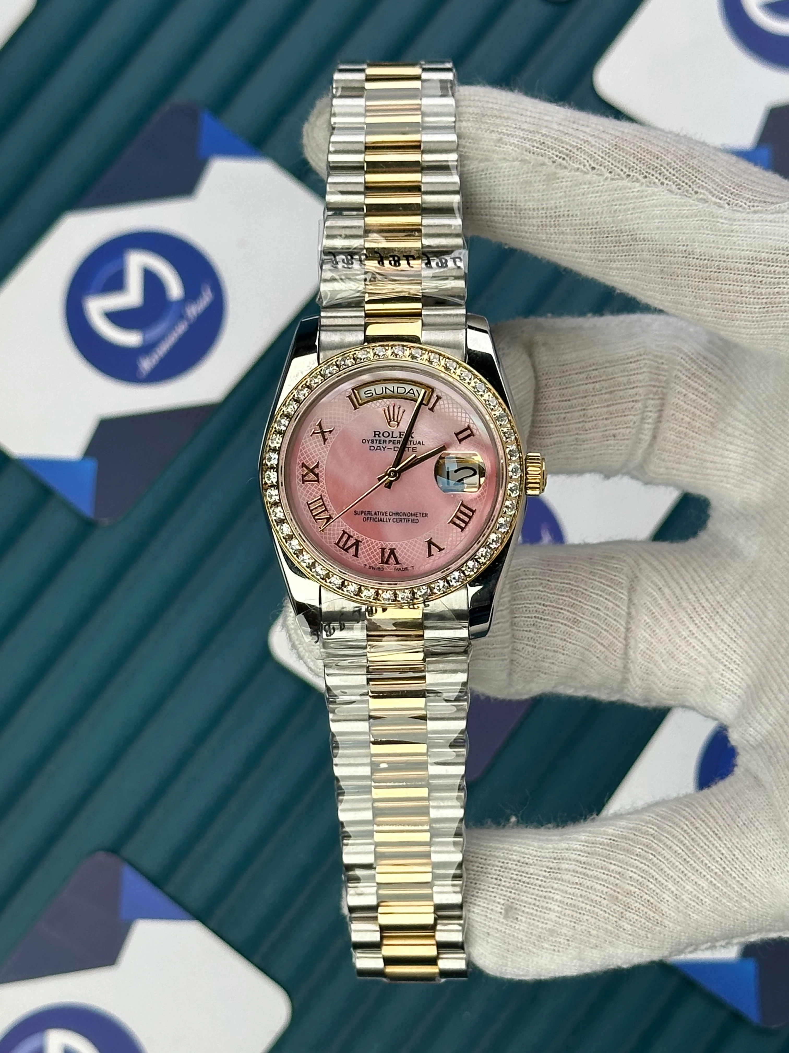 ROLEX 36 MM DAY-DATE PEARLESCENT PINK DIAL GOLD ROMA INDEX DIAMOND BEZEL GOLD-SILVER PRESIDENT