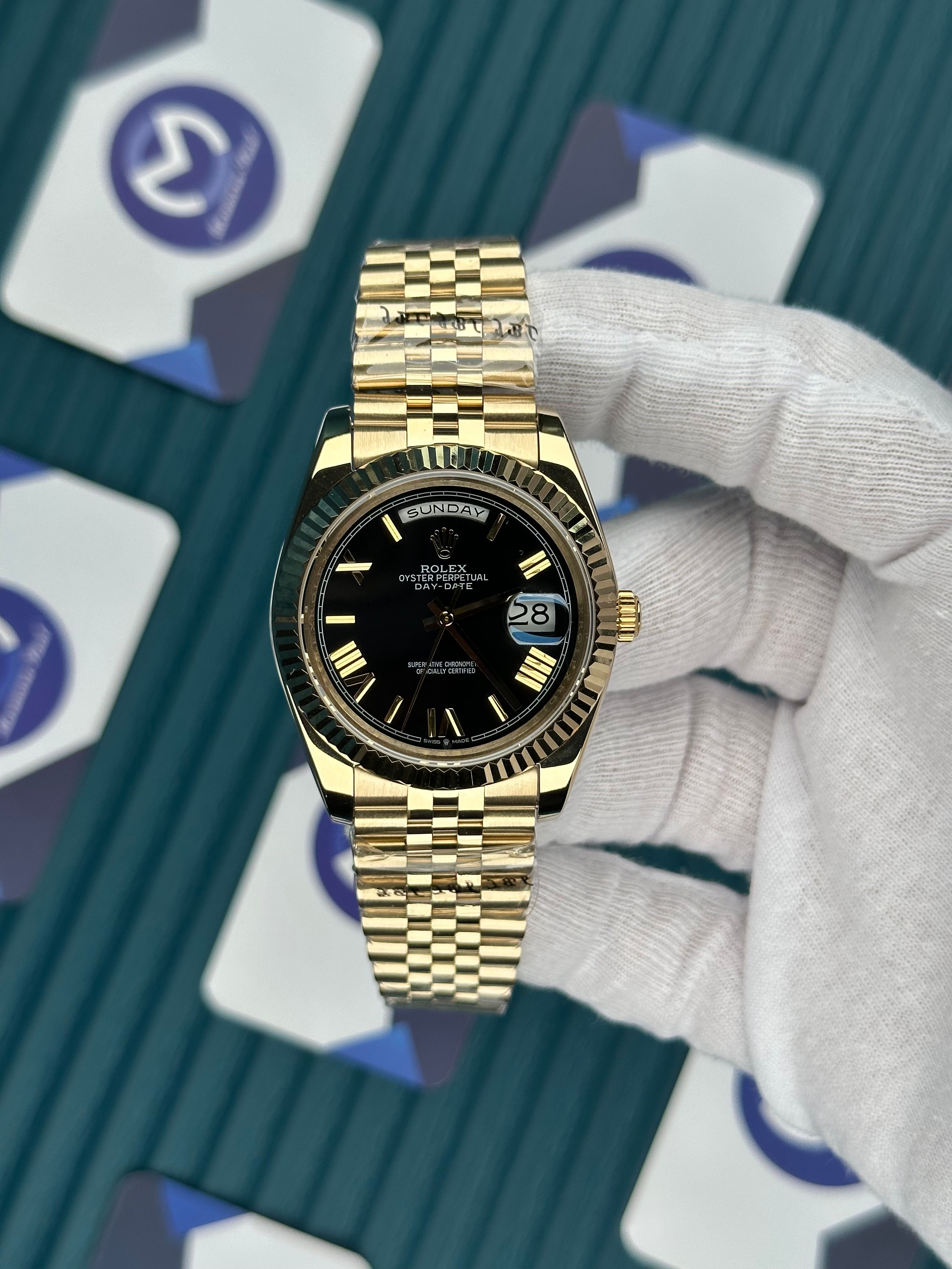 ROLEX DAY-DATE BLACK DIAL GOLD ROMA INDEX GOLD JUBILE