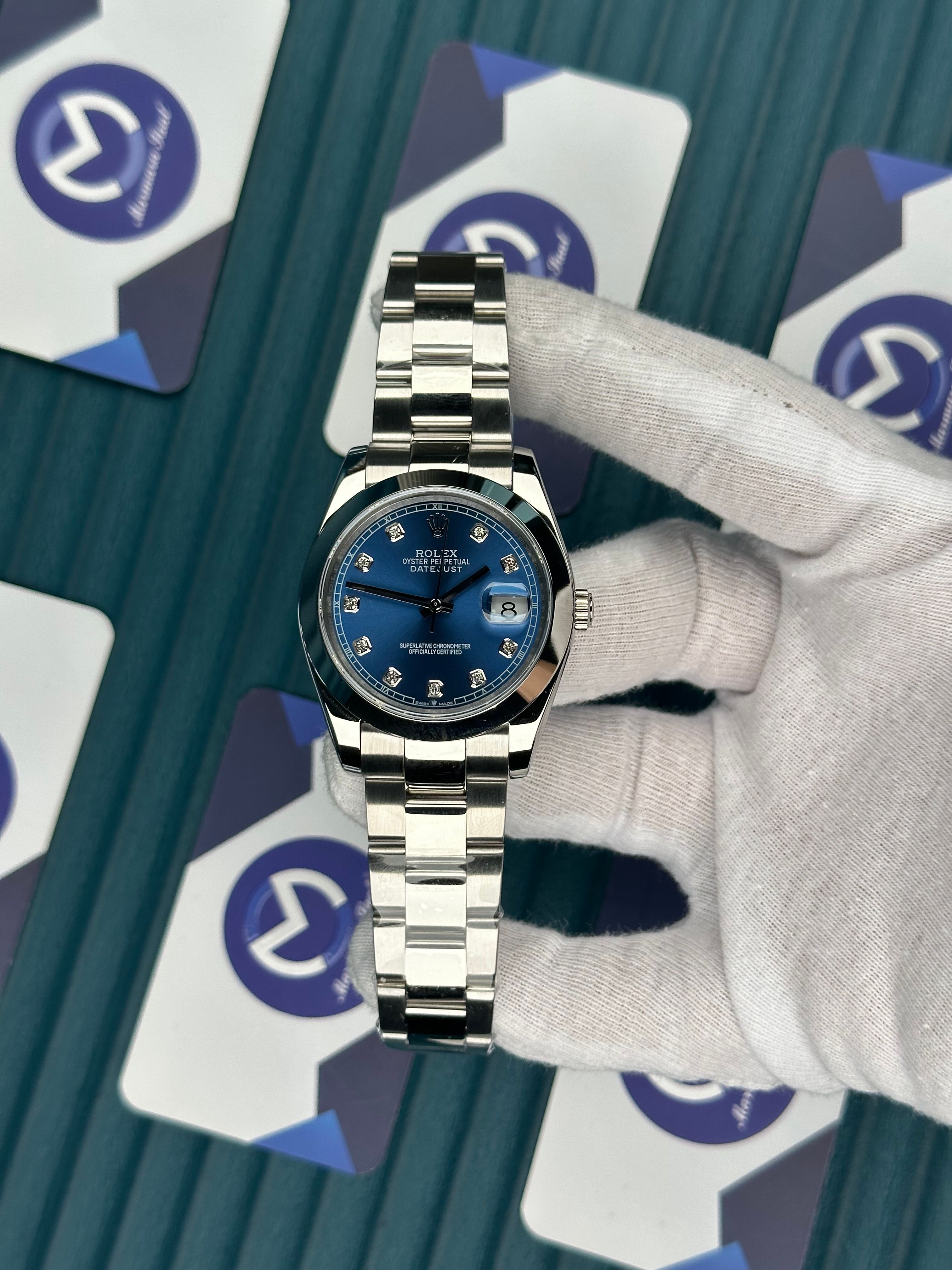 ROLEX DATEJUST BLUE DIAL OVAL BEZEL DIAMOND INDEX SILVER OYSTER