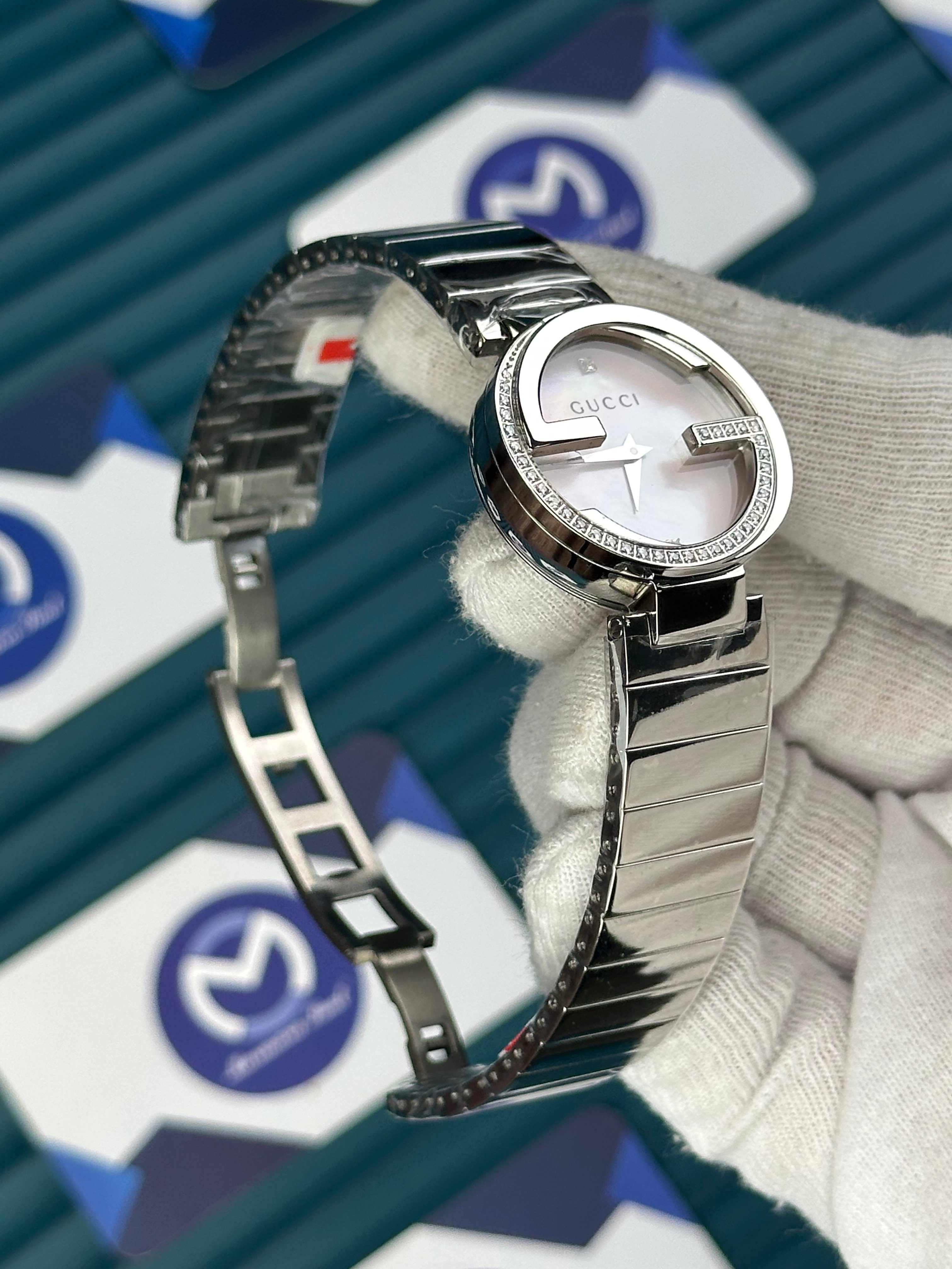 GUCCI WOMAN PINK DIAL G CASAE DIAMOND DIAL SILVER CORD