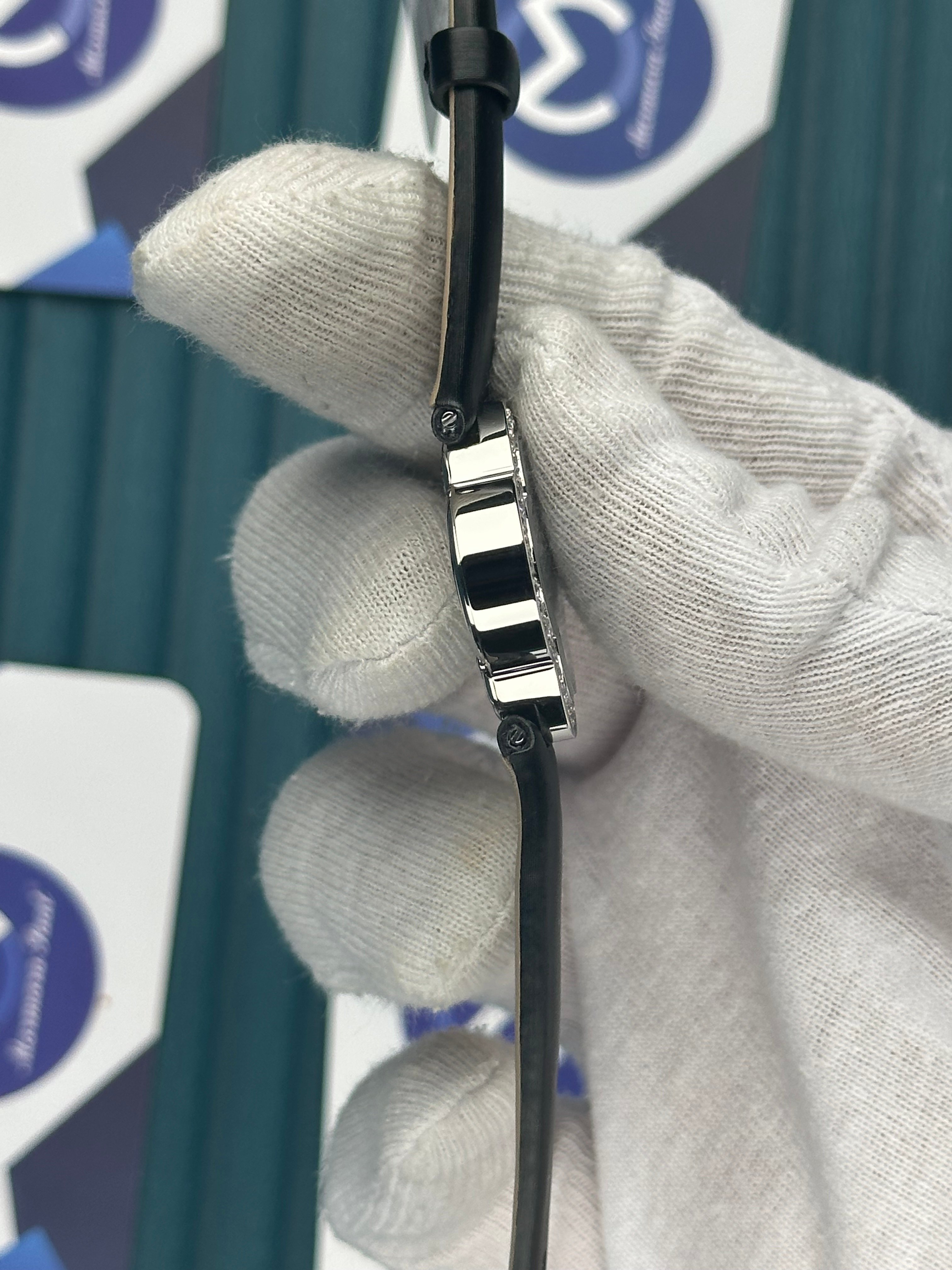 VAN CLEEF & ARPELS WHITE DIAL DIAMOND BEZEL SILVER CASE BLACK LEATHER CORD