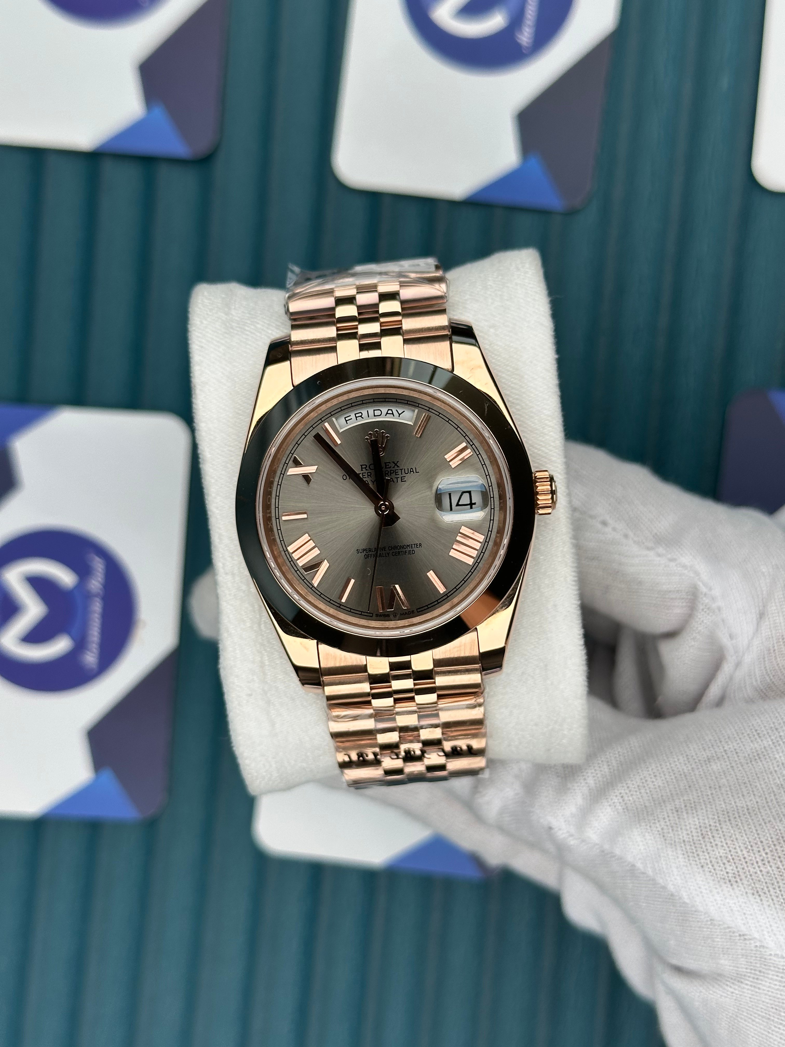 ROLEX DAY-DATE GREY DIAL OVAL BEZEL ROSE ROMA INDEX ROSE JUBILE